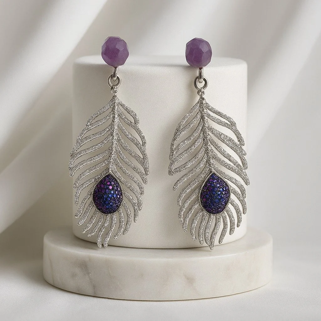 From delicate feathers to bold geometrics, our handcrafted bridal earrings are designed for the bride who dares to be unforgettable. Whether you're saying I do at a sunset ceremony or dancing the night away at your reception, these four statement pai