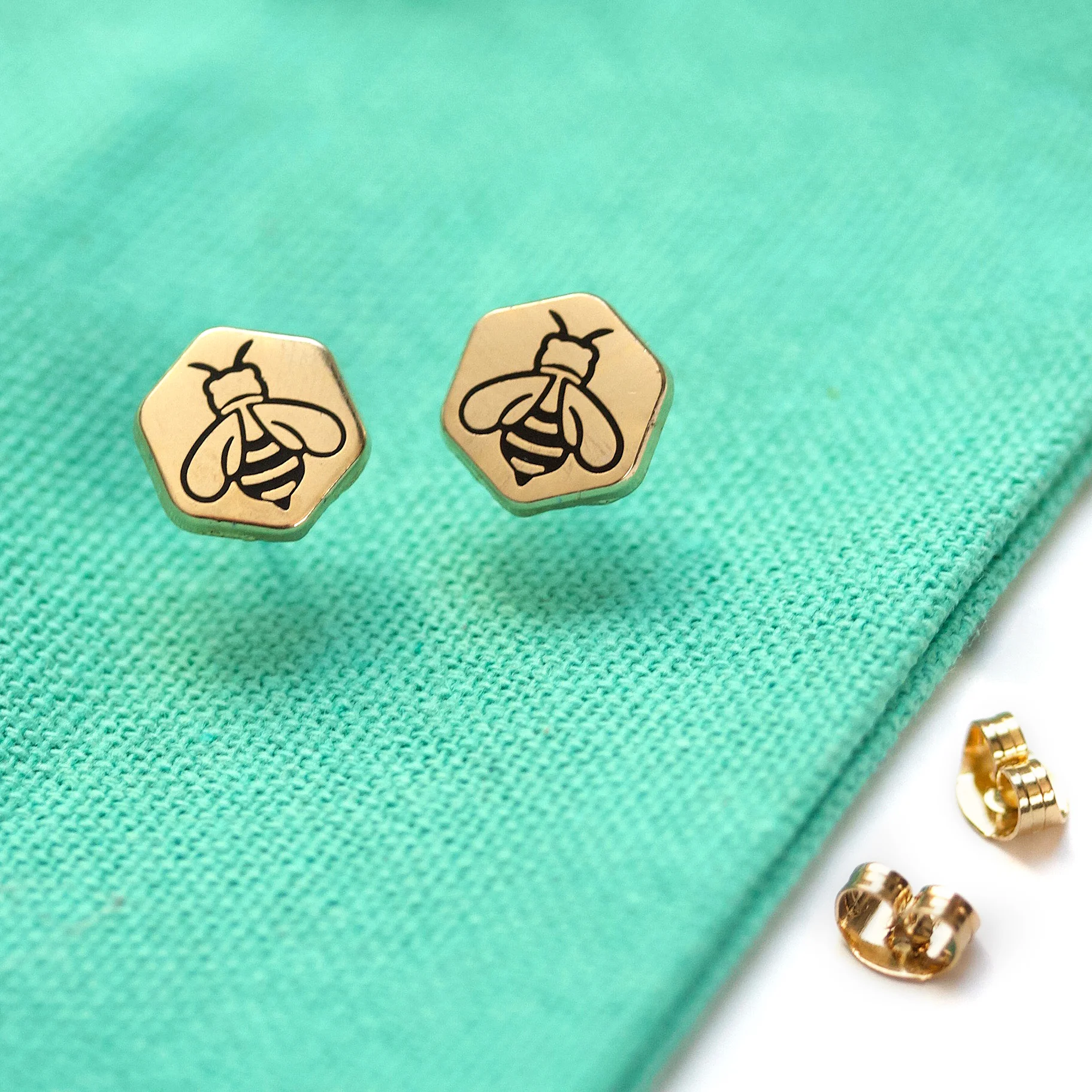 BeeEarringsOnMintFabric.jpg