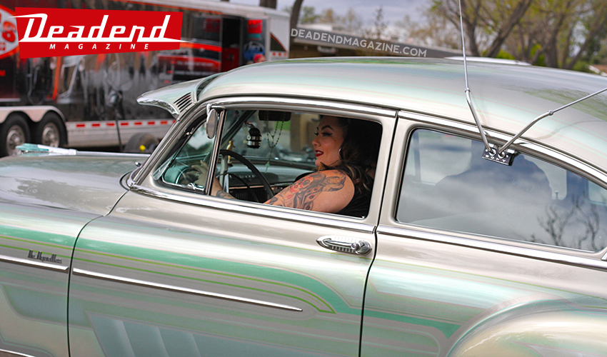 Ruby Ramirez cruisin' her custom painted Chevy bomb.