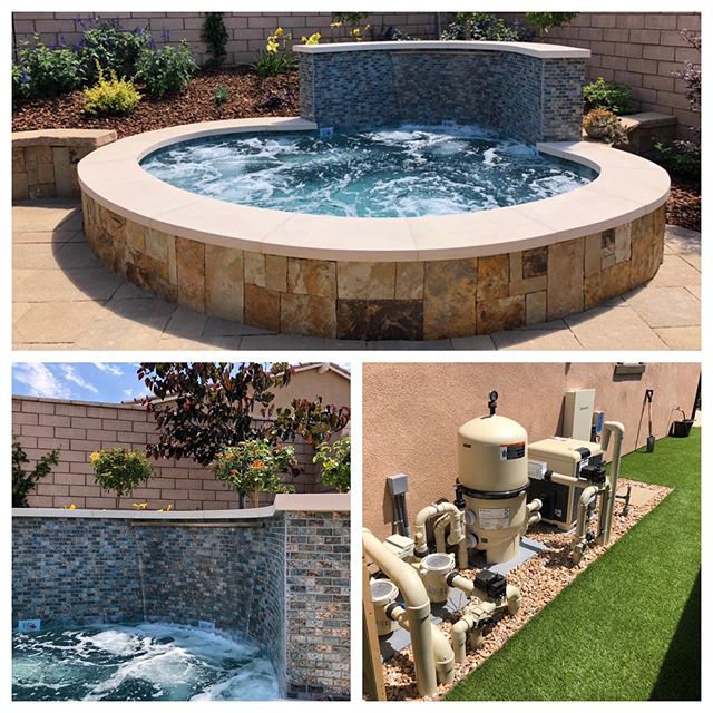 Custom oversized spa with back calf and foot jets along with custom revers radius stainless steel vertical drop waterfall.