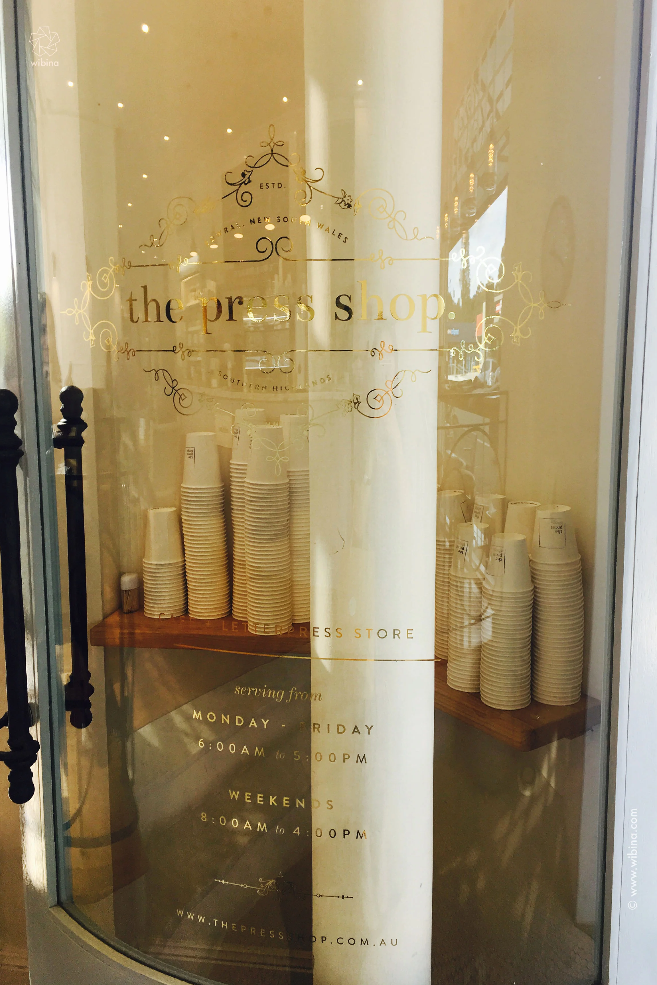 Fell in love with this curved glass door + gold signage..
