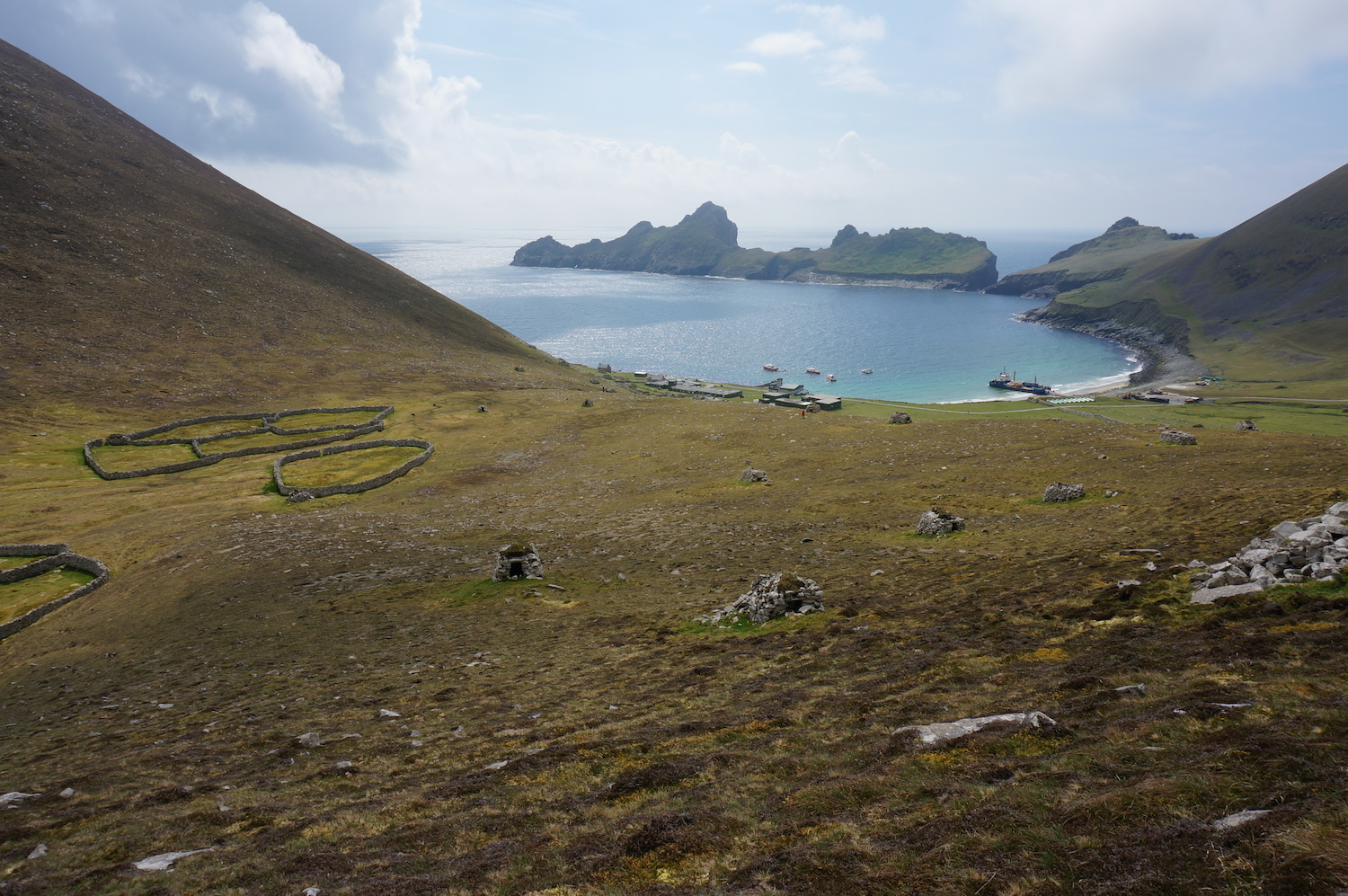 View back down to Village bay with gathering pens. A large barge had docked and was off loading materials for the start of the rebuilding of the MOD base. It was actually quite a busy and noisy day down there!