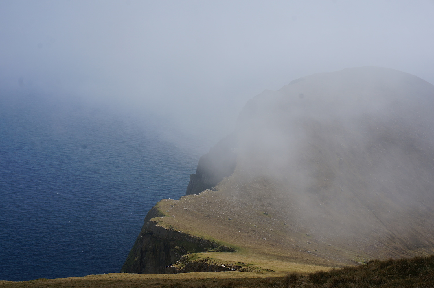 Clouds flooded in across Village bay engulfing me in drizzle as I climbed to the summit.