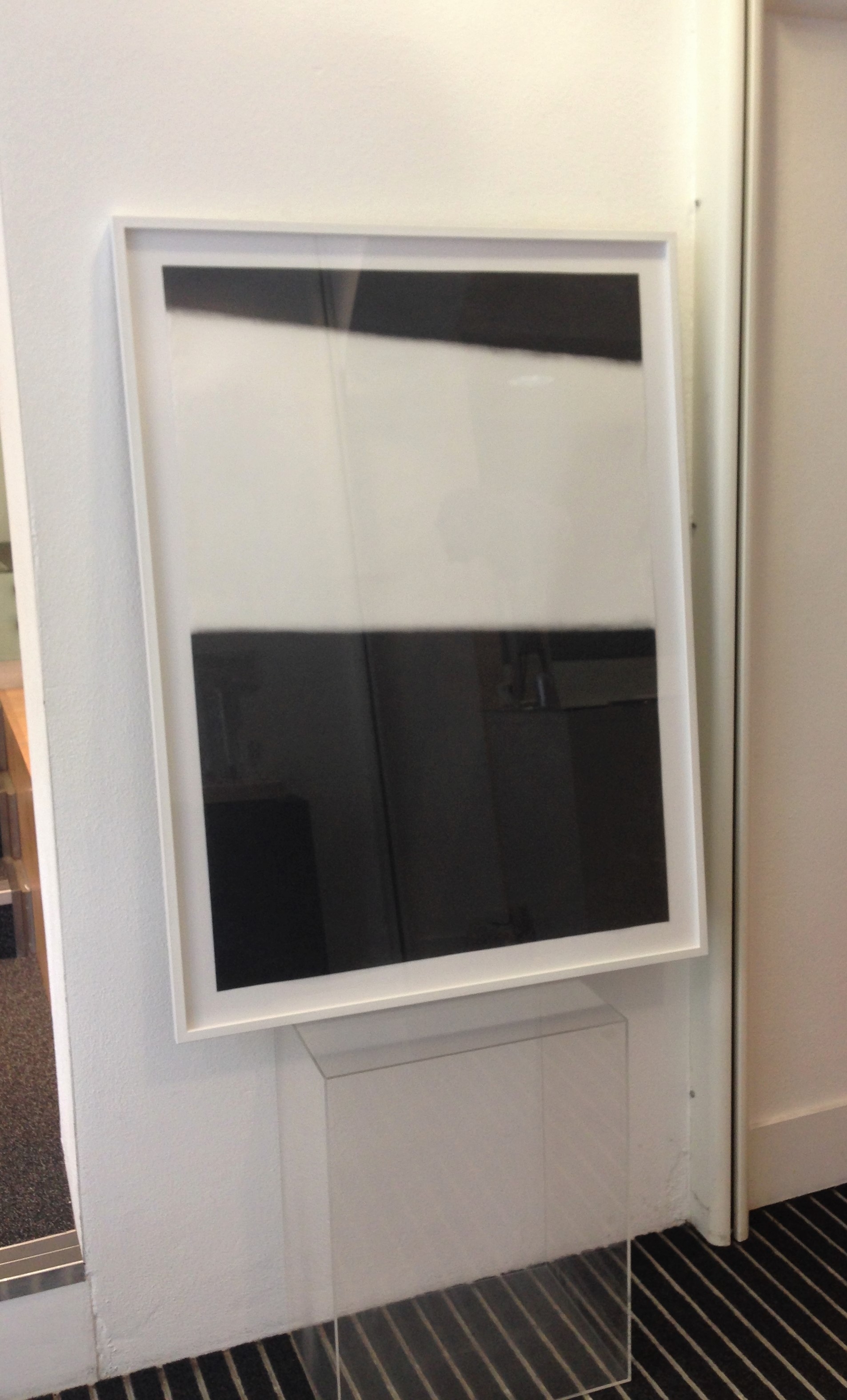 One of the original charcaol AO pieces, framed.
