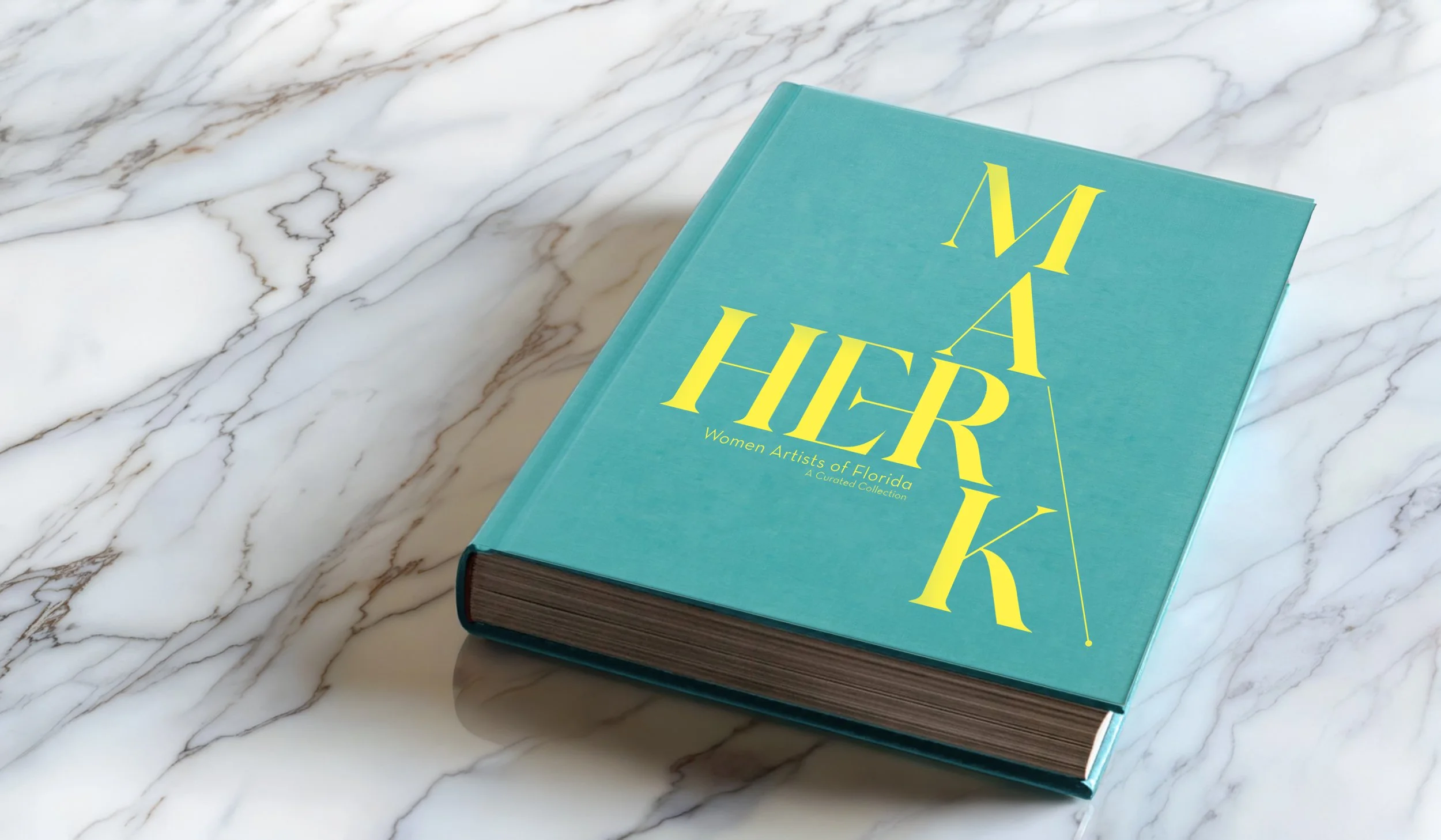 HerMark book table mockup.jpg