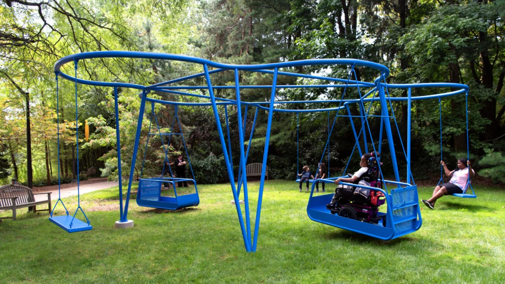 Cloud Swing public art installation with electric blue curved steel canopy