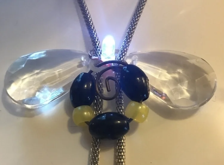  Butterfly necklace made with an LED and battery pack.&nbsp; 