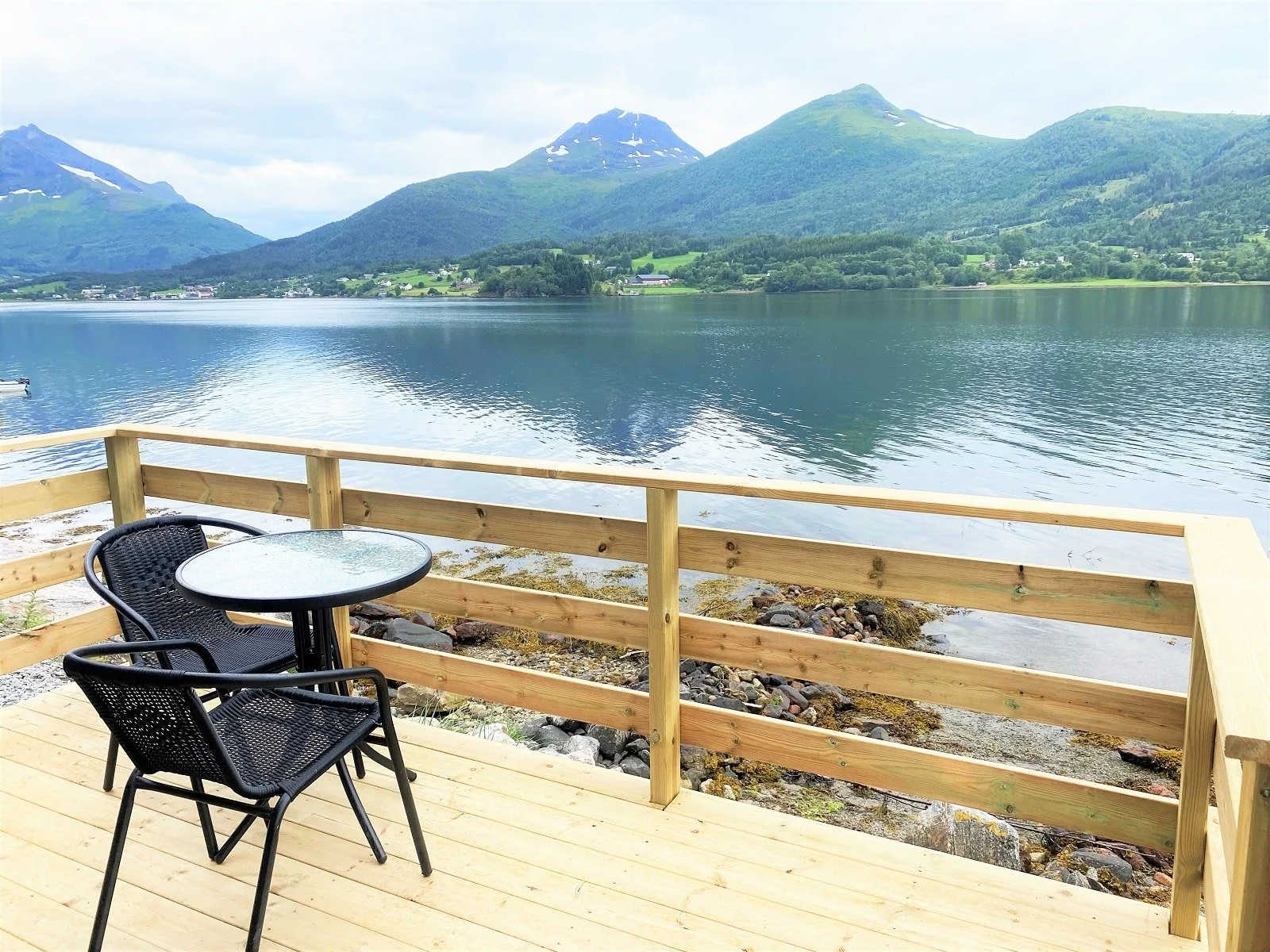 Cabin 8 Balcony table - water front-mountains-fjord view.jpeg