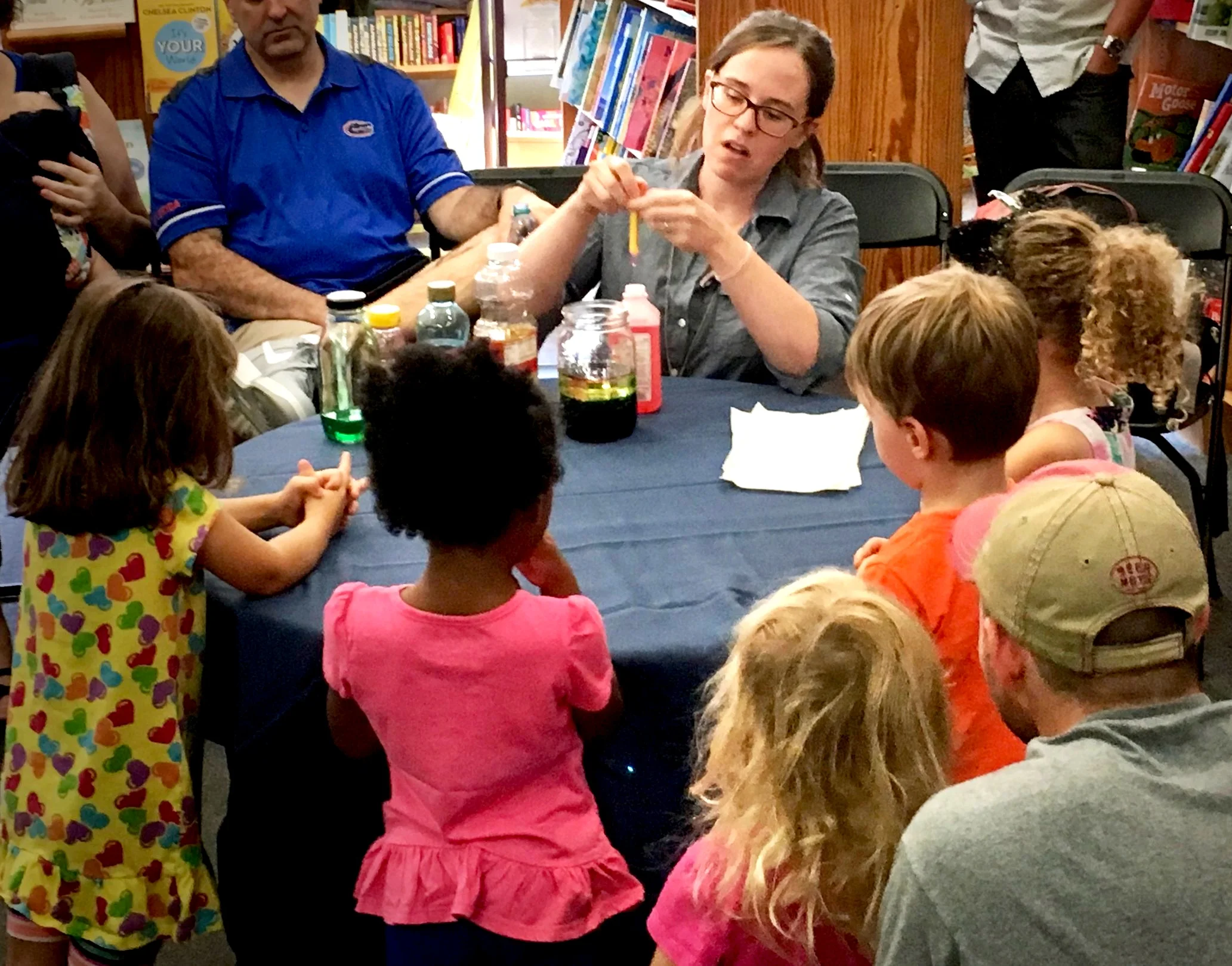 Making a rainbow in a jar - small group science experiment.