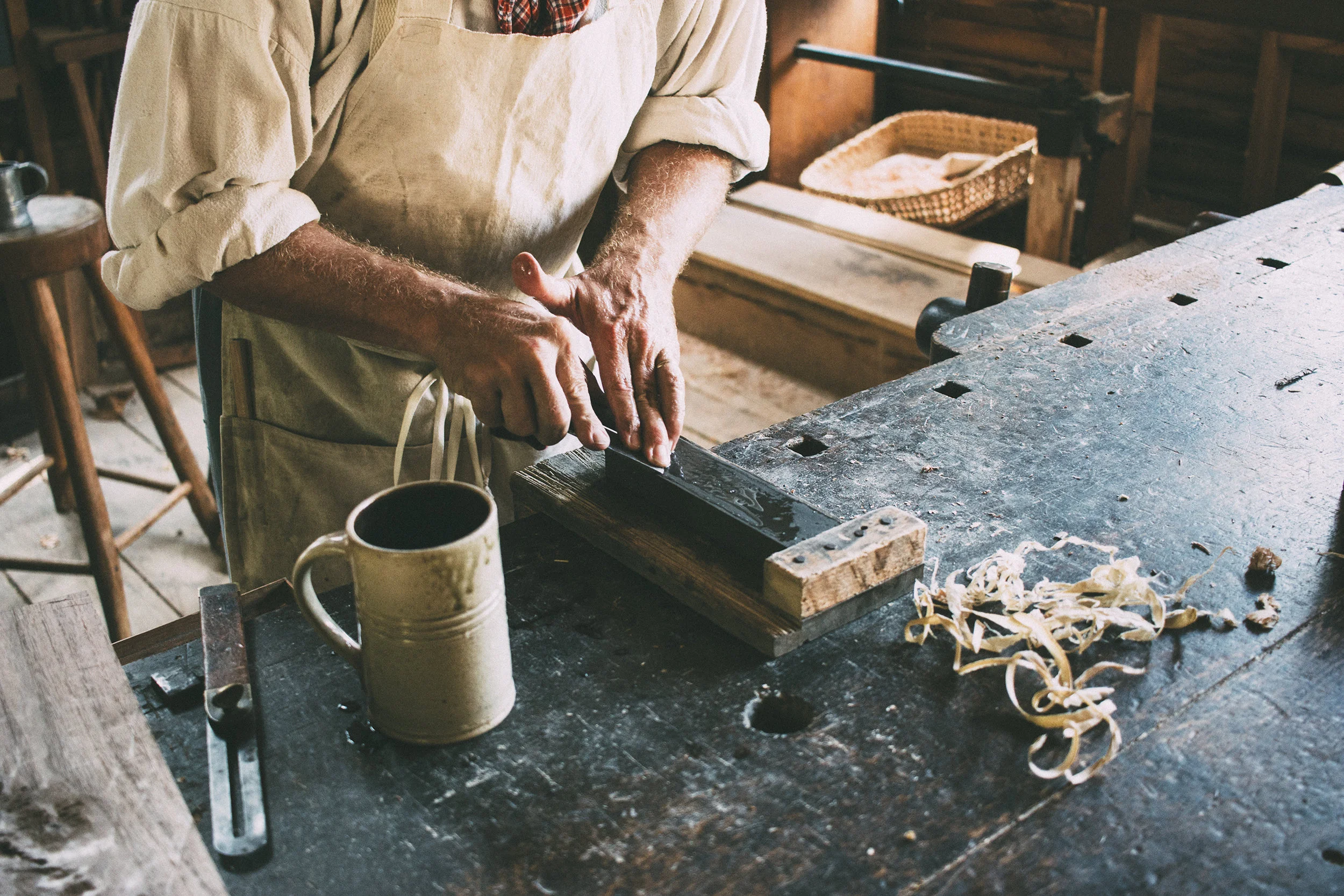 The woodworker showed us how he sharpens blades with a wet stone.