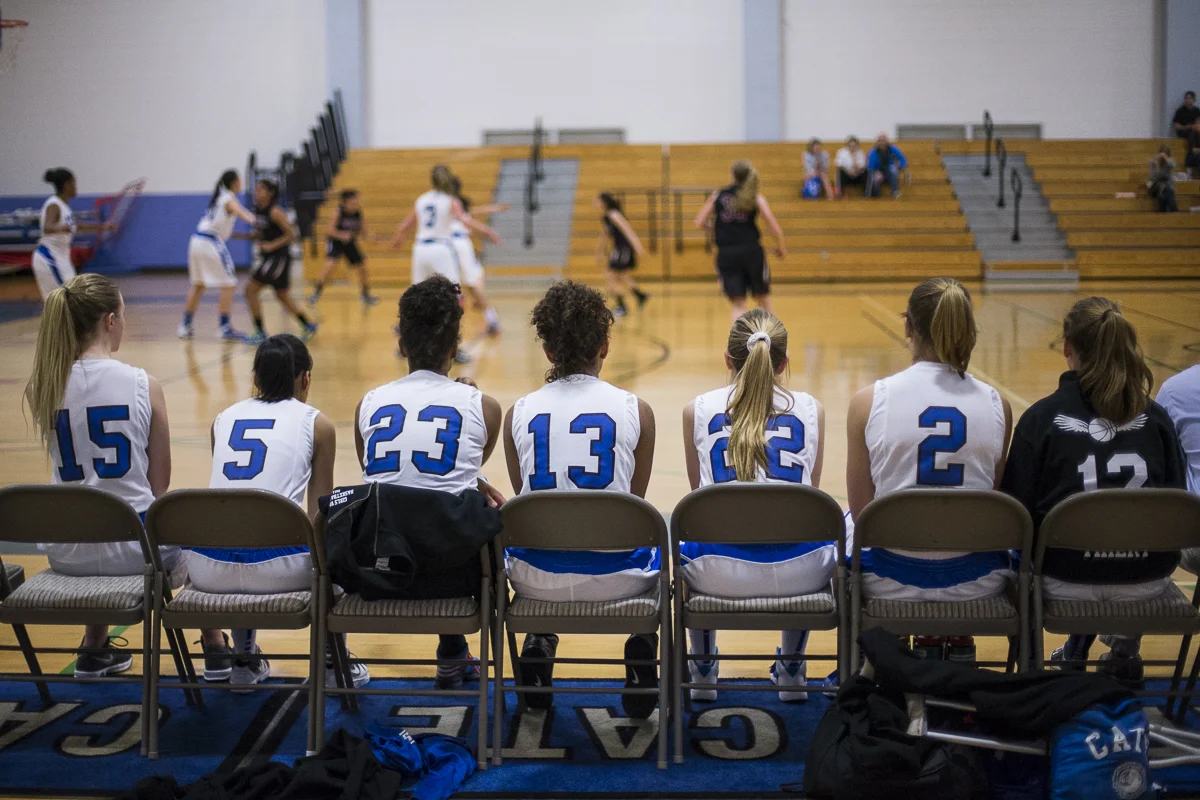 Members of the Cate School Woman's Basketball team watch their team win 54-33 against Foothill Technology on Thursday, February 5th 2015 at the Cate School in Carpinteria, Calif. (© Fernando J Tirado 2015)
