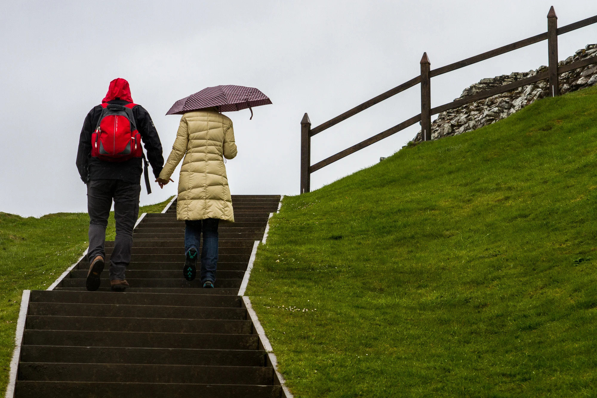 Italian tourists Bellina Conti and Taziano Sagese hold hands as the ascend the steps to what remains of Urquhart Castle, located on the banks of Loch Ness near Inverness, Scotland on Thursday May 2 2013. (© Fernando J Tirado 2013)