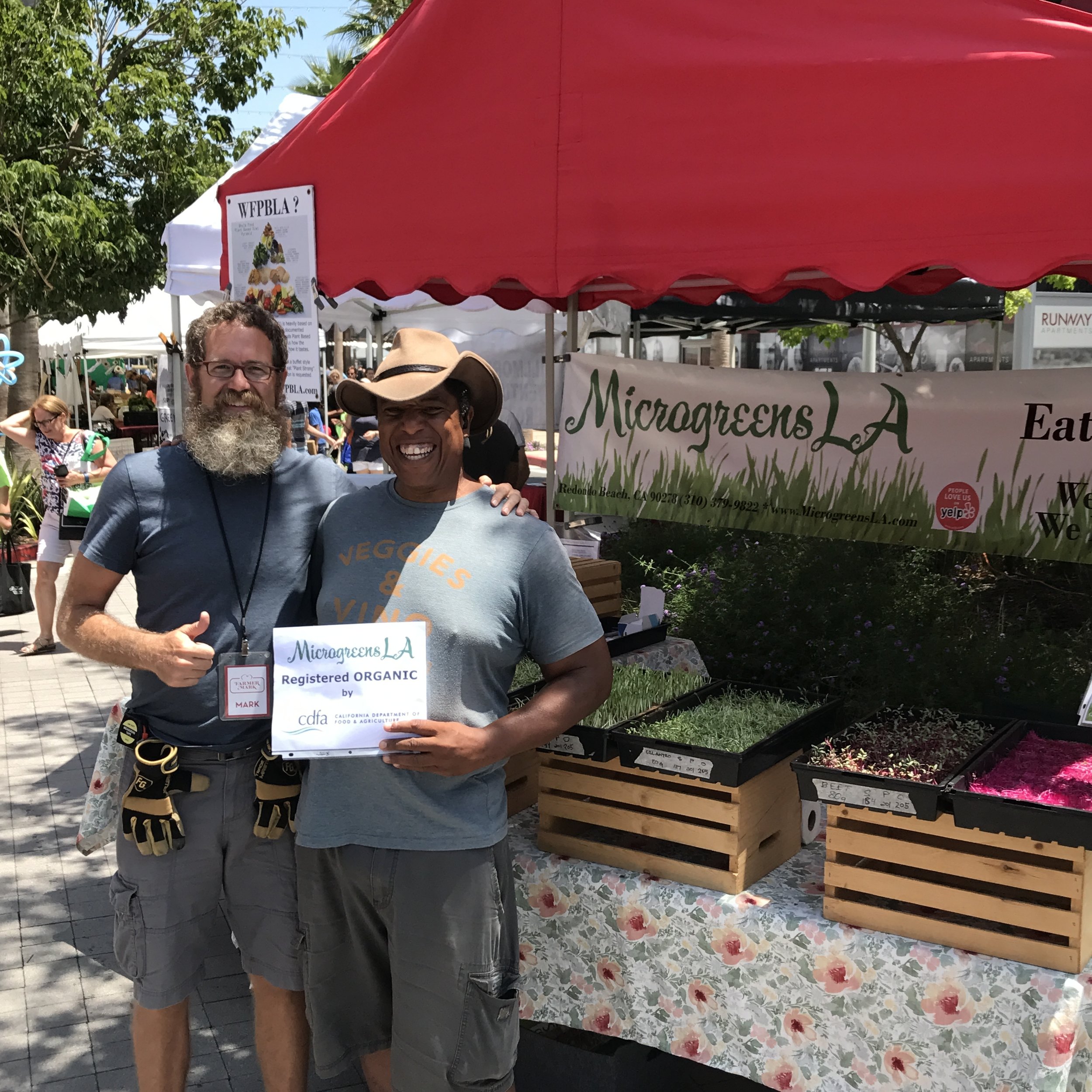 Farmer Mark and Farmer Joe celebrating MicrogreensLA Organic registration. 
