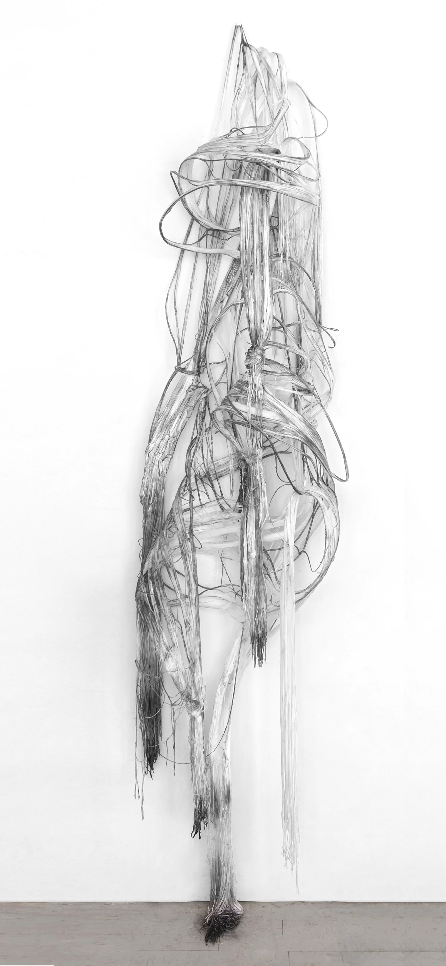 Unraveling Void, 2015, Graphite and mixed medium on silk/polyester thread 76.5 x 19 x 13 inches
