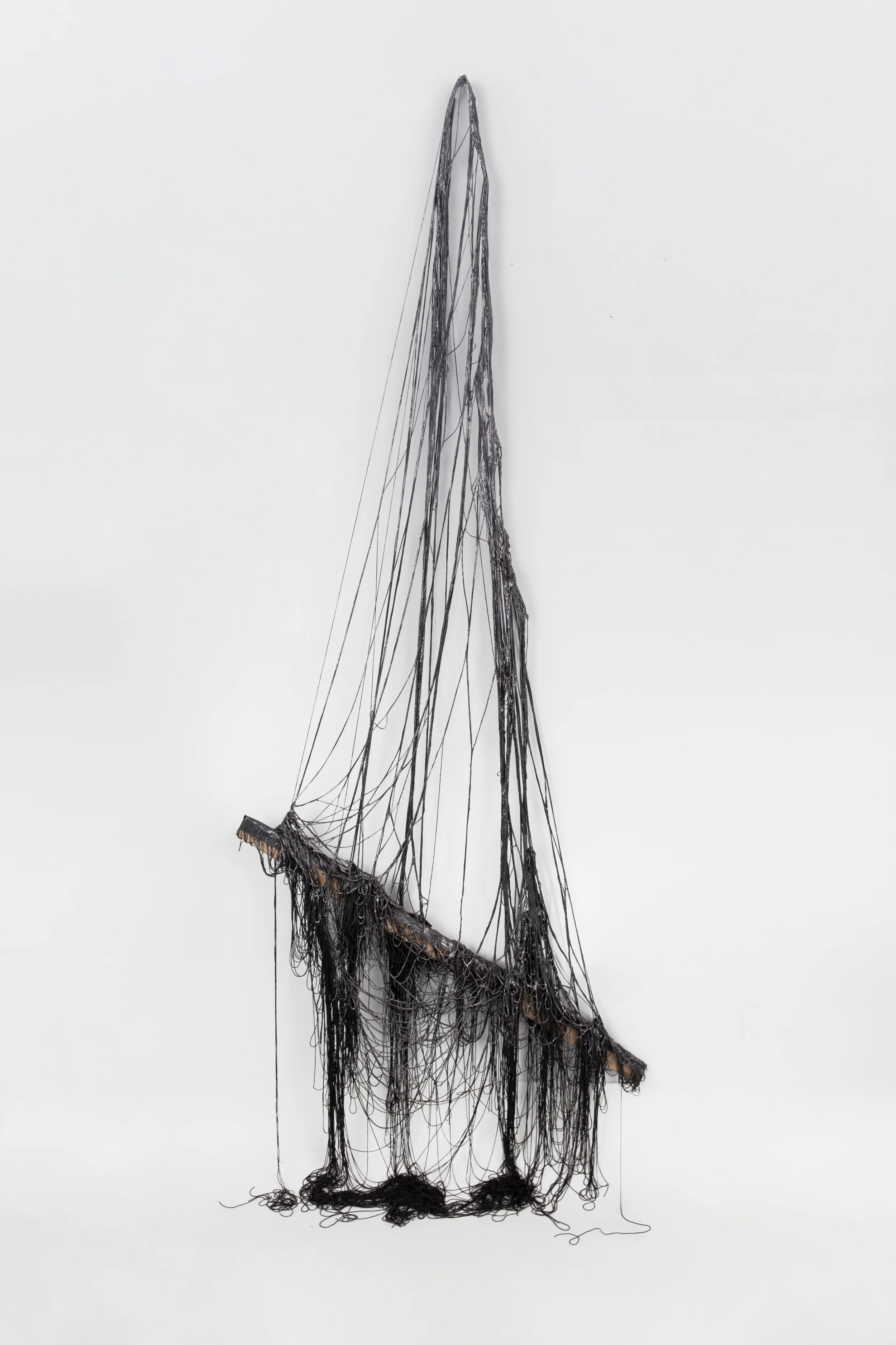 Dredging Up, 2016, Graphite and mixed medium on silk/polyester thread, wood, and steel mesh, 87 x 38 x 2 1/2 inches