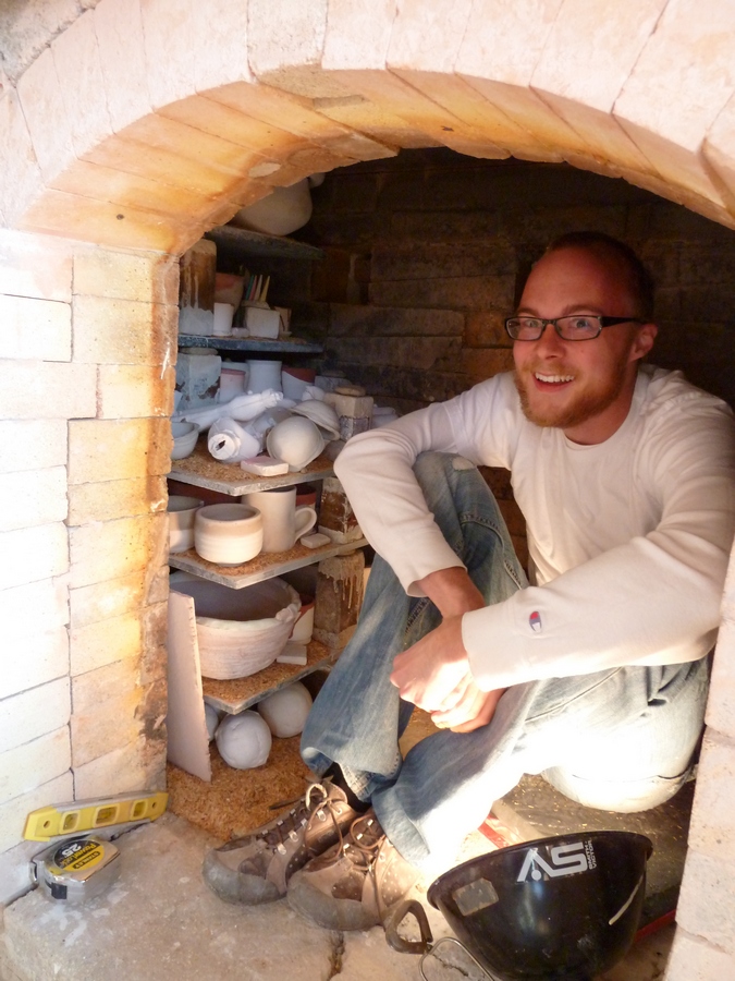 Corey loading the kiln