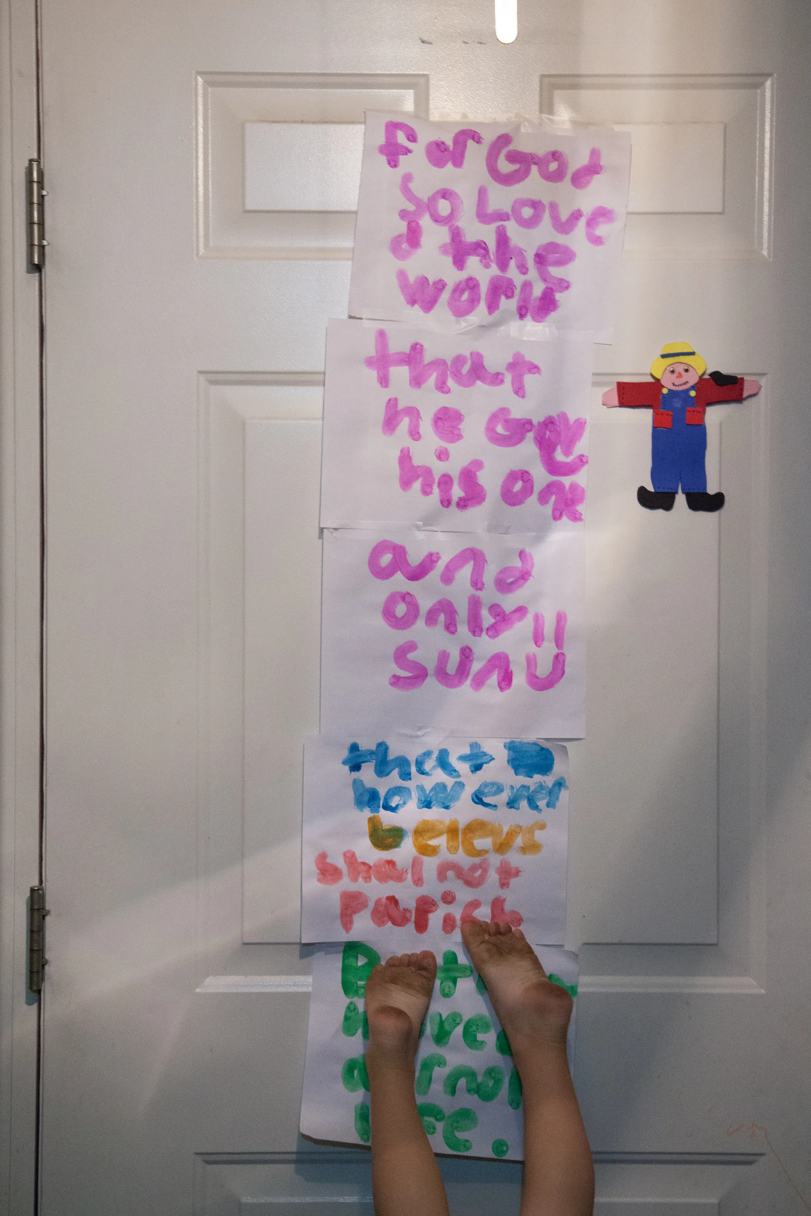  Dillon Kelly does a handstand against the front door of his home in Hagerstown, M.D. on Nov. 25, 2015. His sisters Robin, 8, and Airiana Kelly, 10, painted the sign with words to God. 