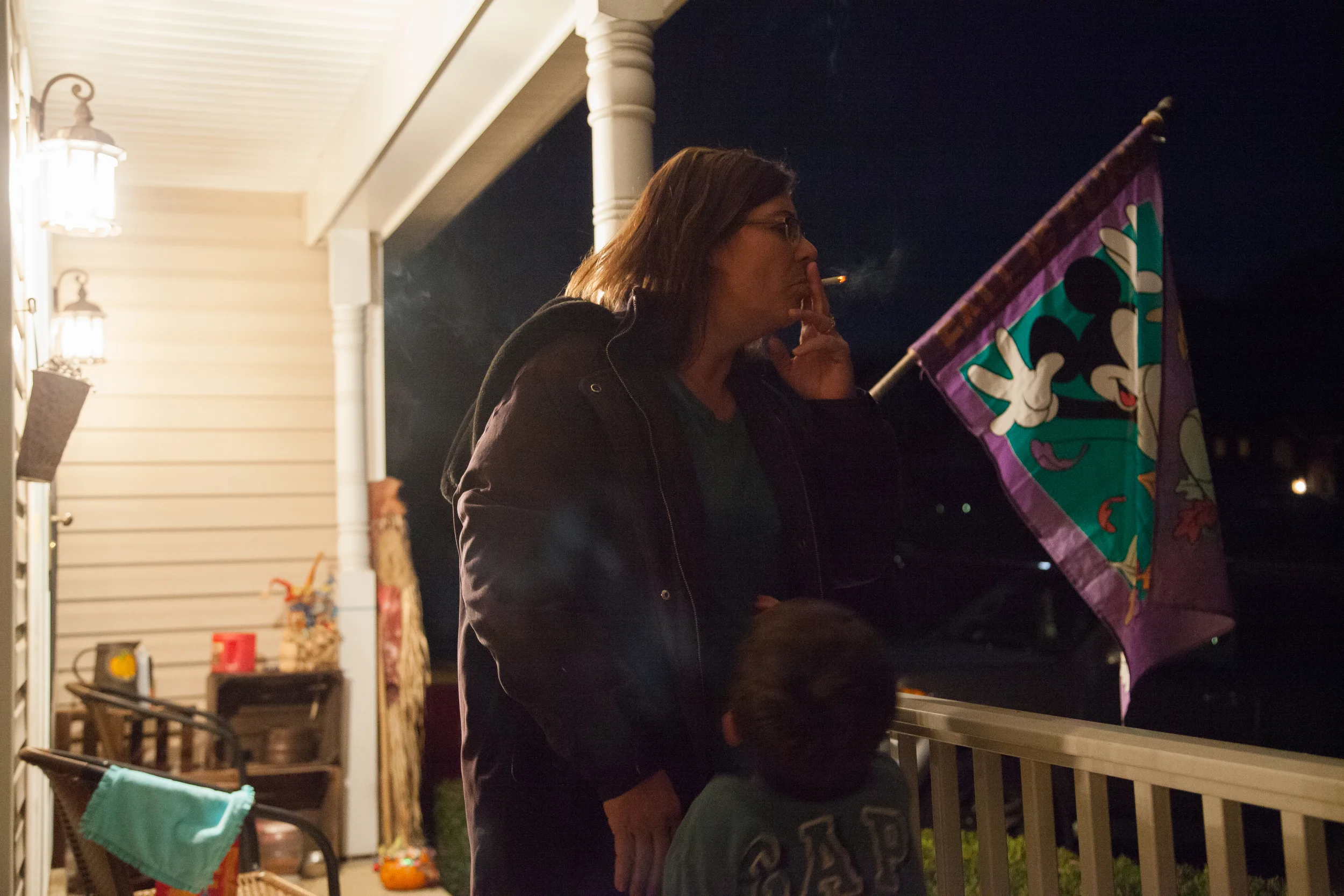  Jamie Kelly takes a moment to relieve her stress over Thanksgiving weekend while her son, Dillon Kelly, tries to climb into her arms their home in Hagerstown, M.D. on Nov. 25, 2015.&nbsp; 