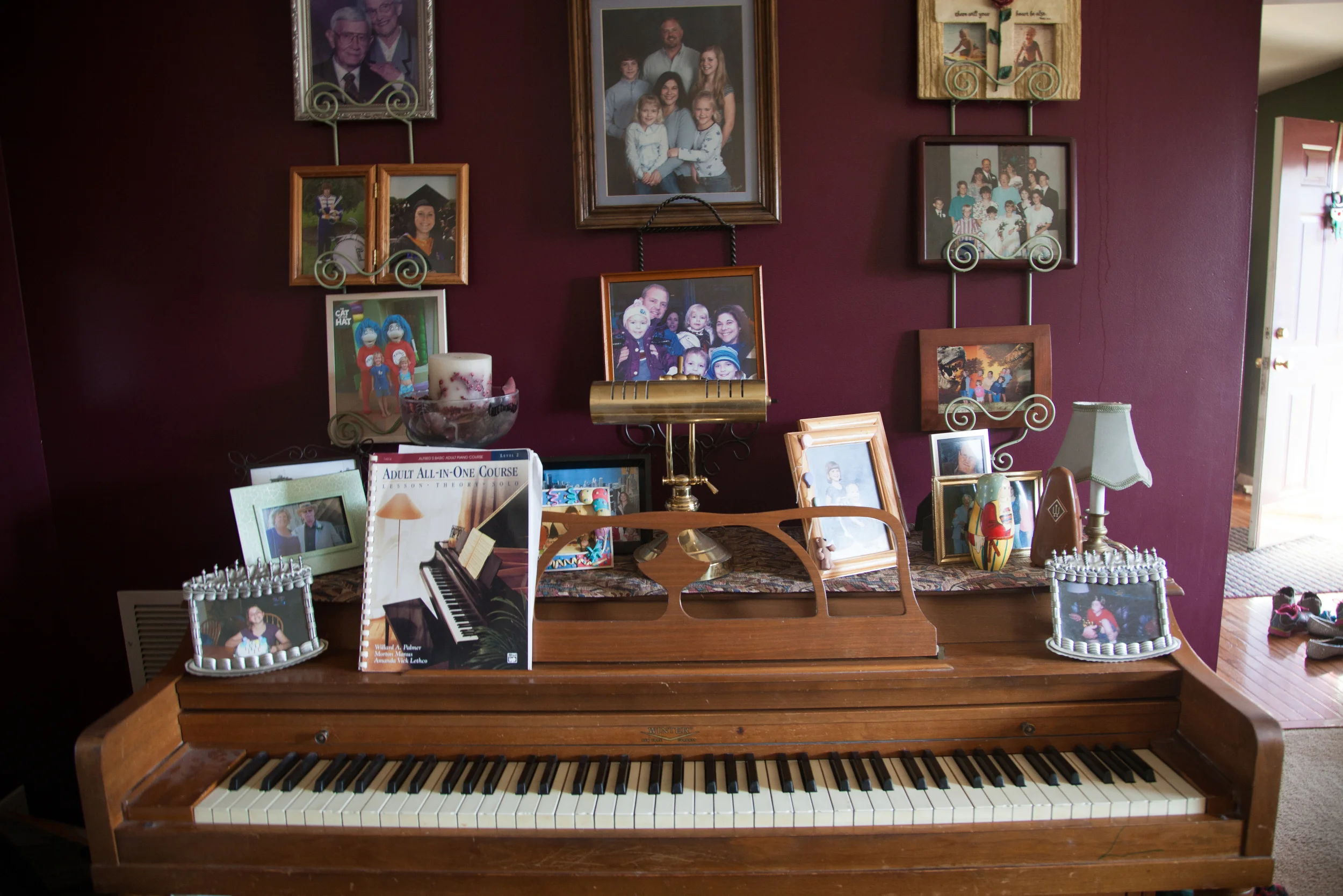  The Kelly’s piano is covered in pictures of their family and mementos from their life.&nbsp; 