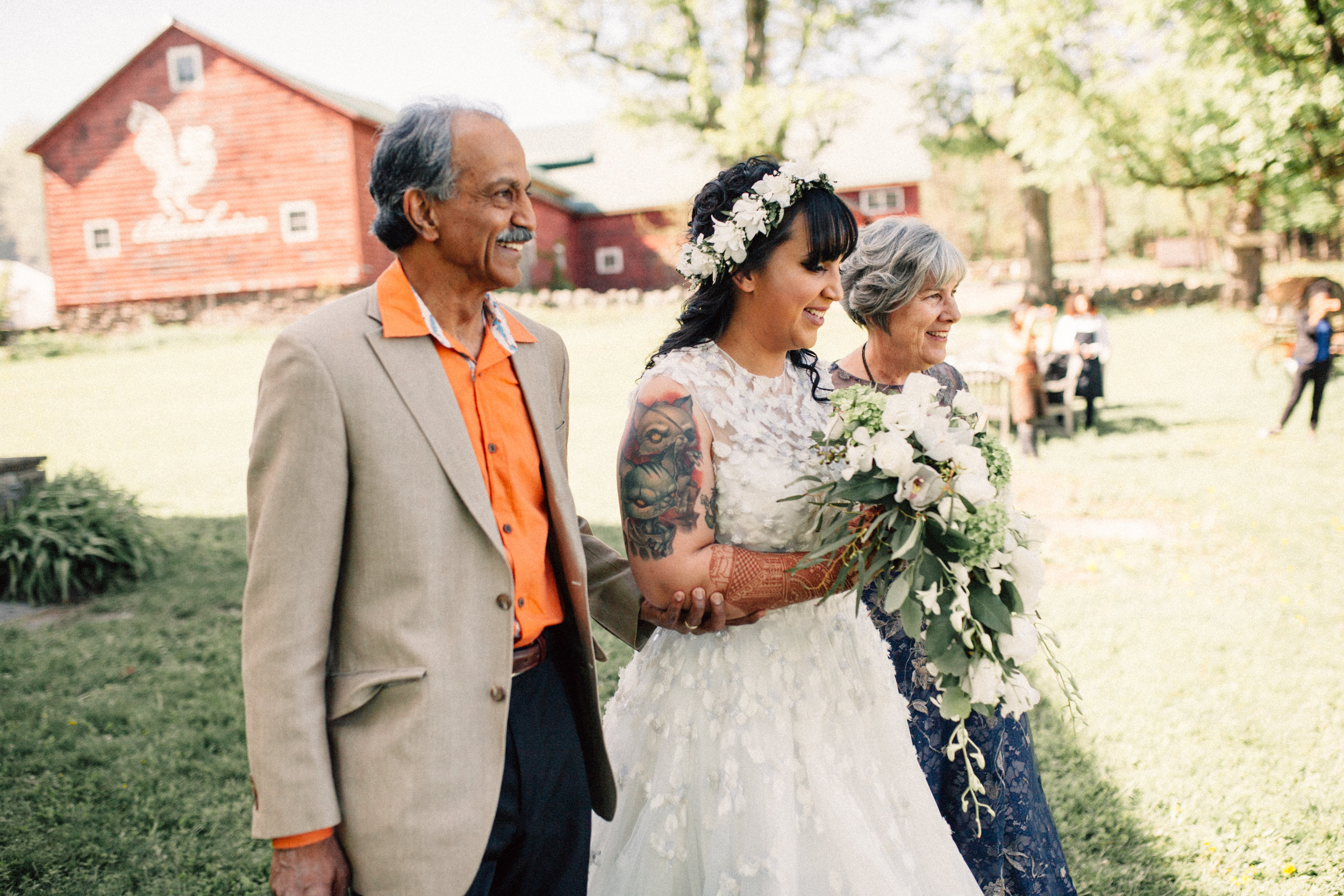 Parents walking their daughter down the isle