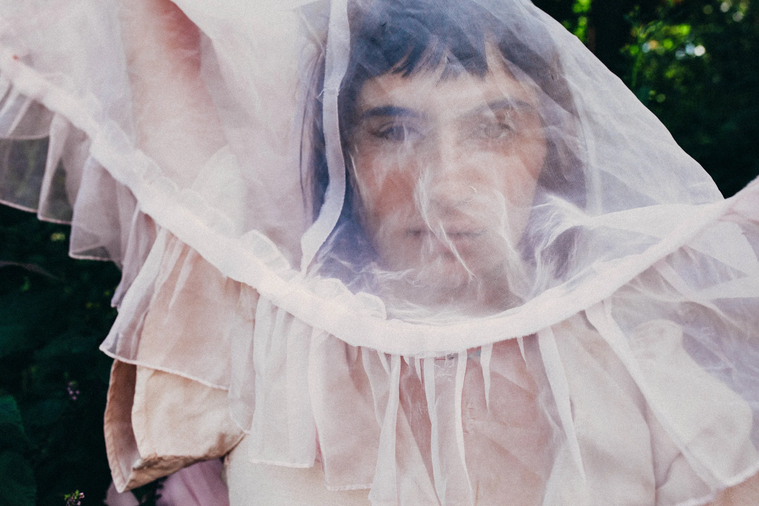 portrait of a girl with pink fabric