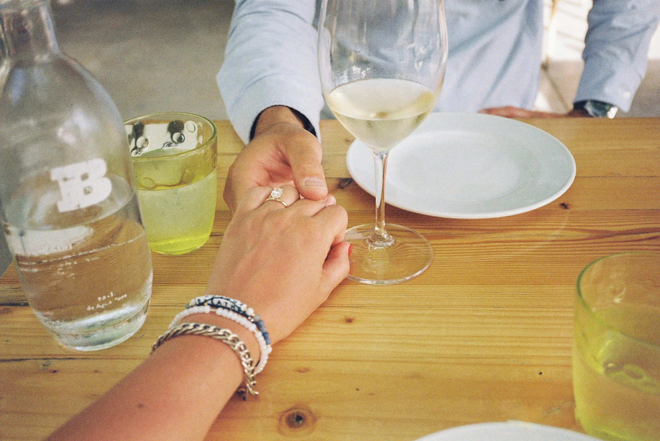 ann-millington-photography-menorca-couple-engagement-ring-restaurant-shot-on-film.jpg