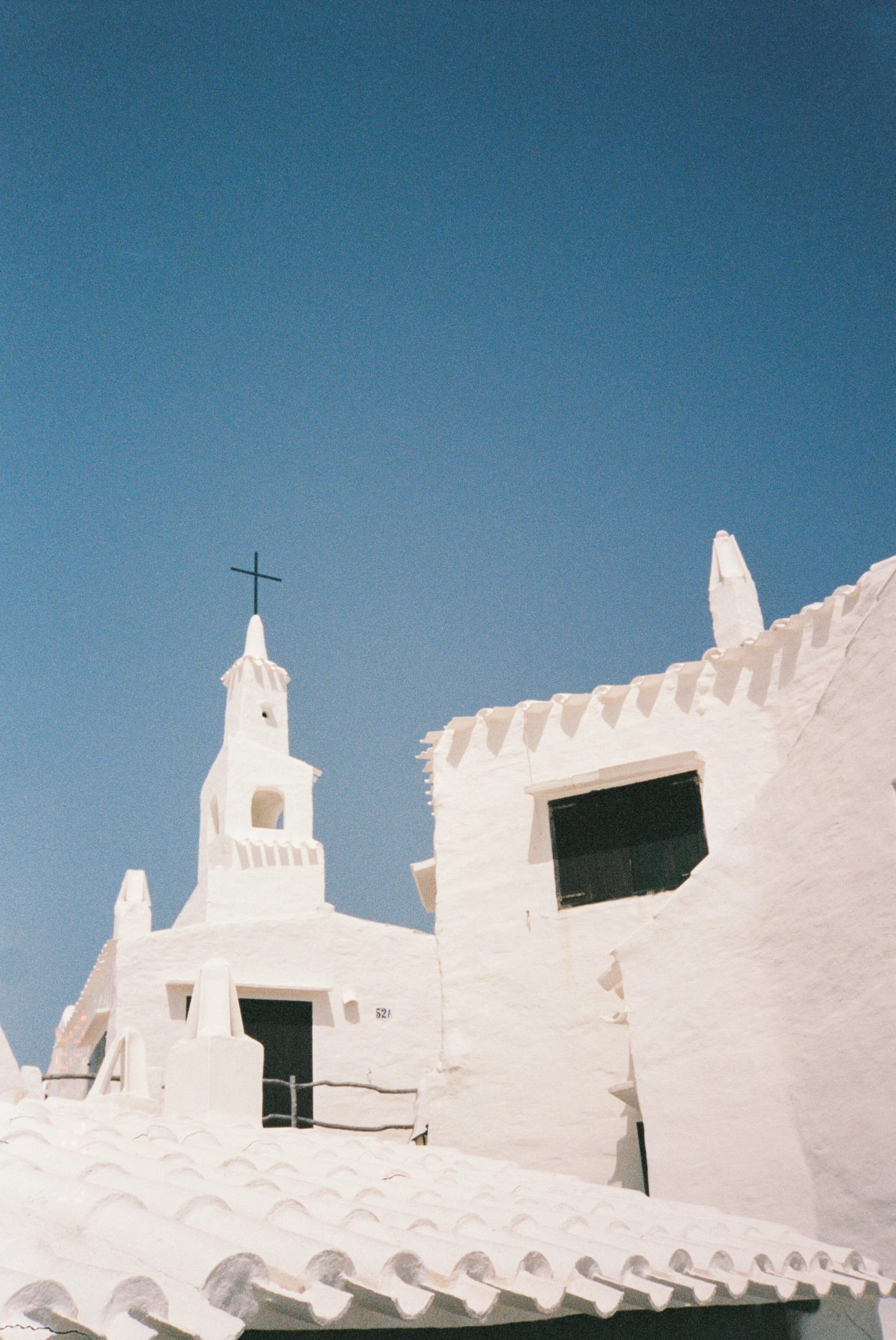 ann-millington-photography-menorca-whitewashed-church-blue-sky-architecture-shot-on-film.jpg