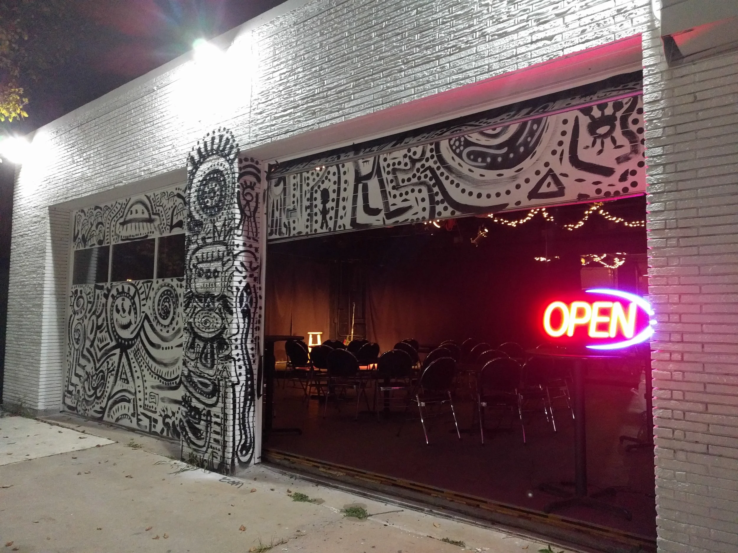 Our artistic exterior opens up to reveal our space during nice weather.