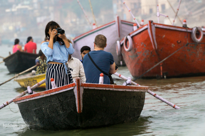 Tourist-taking-photo-from-boat-in-Varanasi-666x443_c.jpg