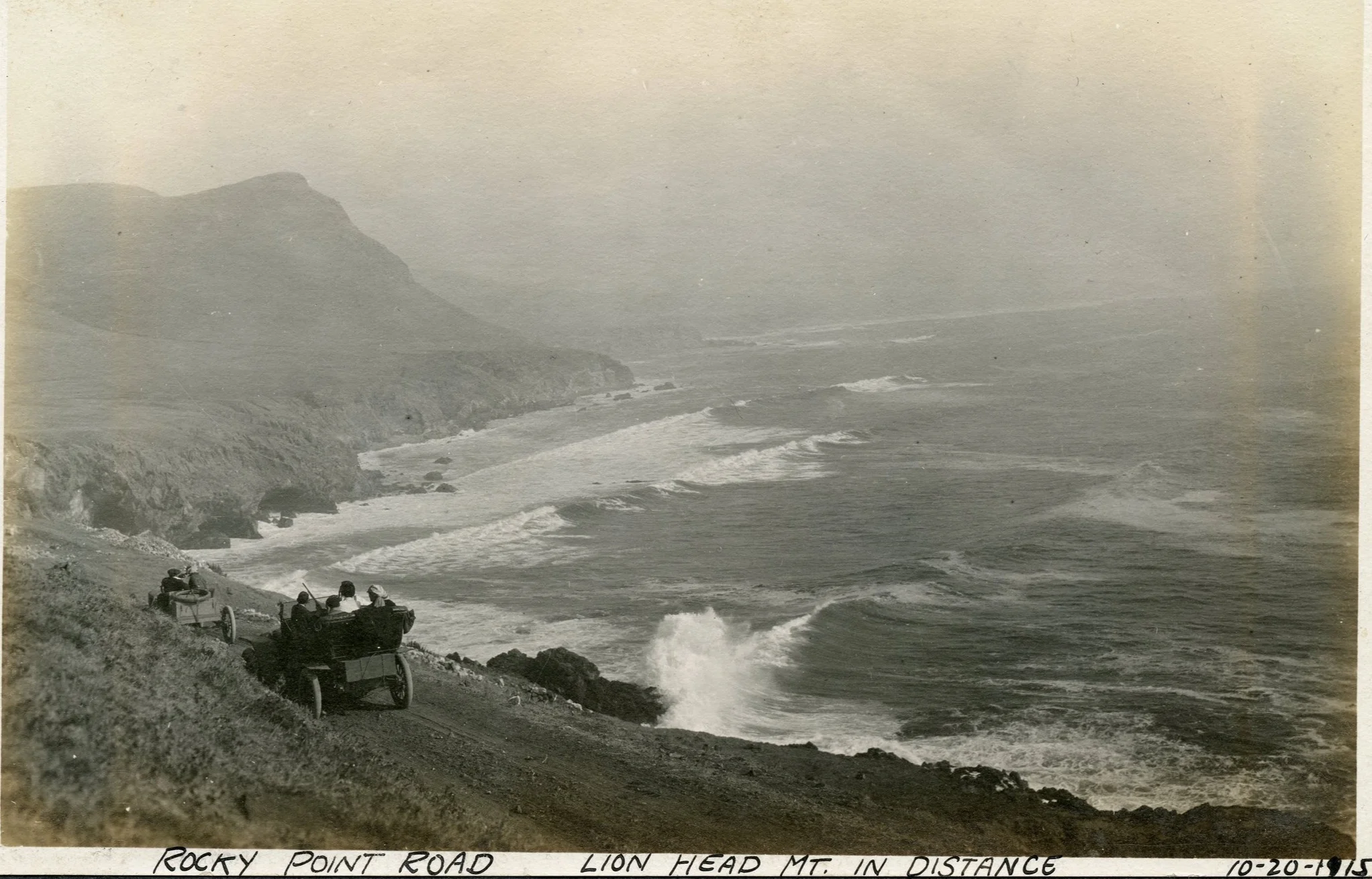 #122218-02 Old photo taken in 1915. Any one know where Lion Head Mountain is? Can you identify either of the cars?