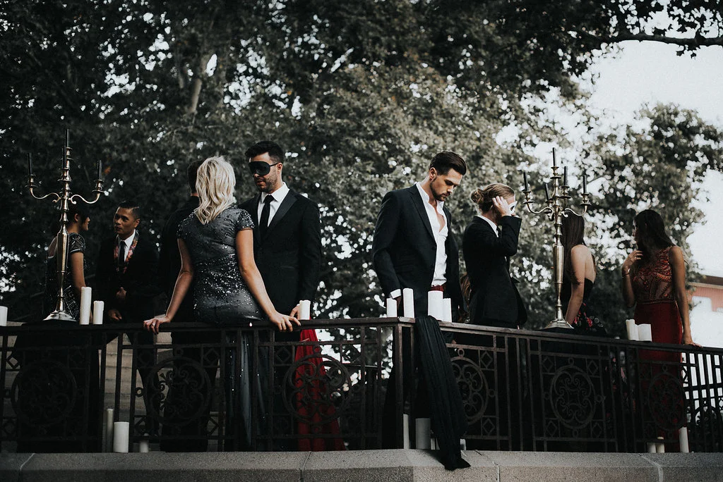 DETAILS Photography: Hailey Arnold Event Design: Leslie Dawn Events & Sax Romney Makeup: Vivian Johnson Dresses: Dress Collective Suits: Perfectly Suited Masks: Masked Zone Models: Carlie Stylez , Jackson Wood , Kim Kienow , Derek Richmond , Nadya Cox , Robert Naylor , Noah Jarman , Natalie Workman , Josilyn Vassau , Lucy Lu , and Joe