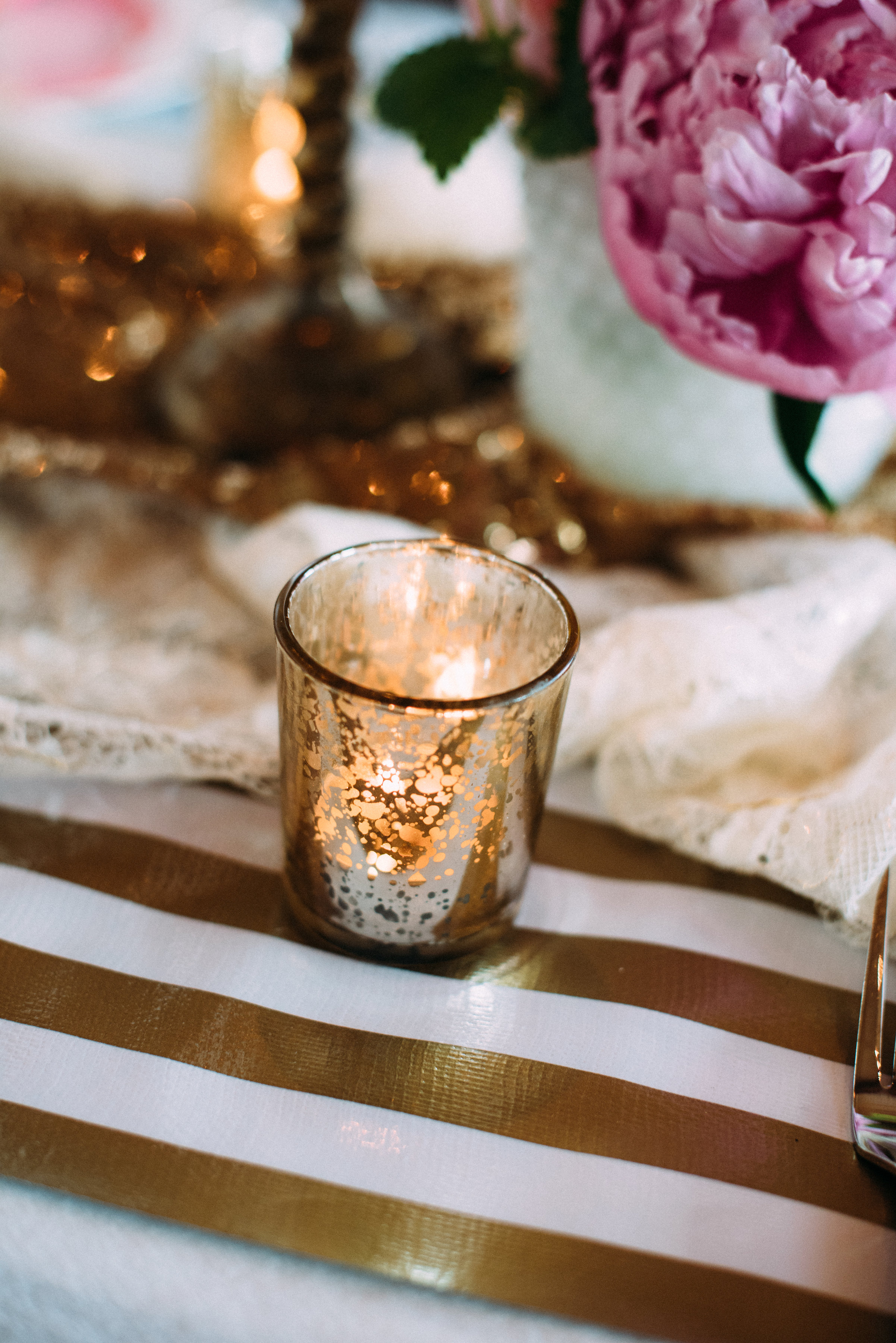  Create loose groupings of threes down the table, pairing flowers, candles and decor together. 