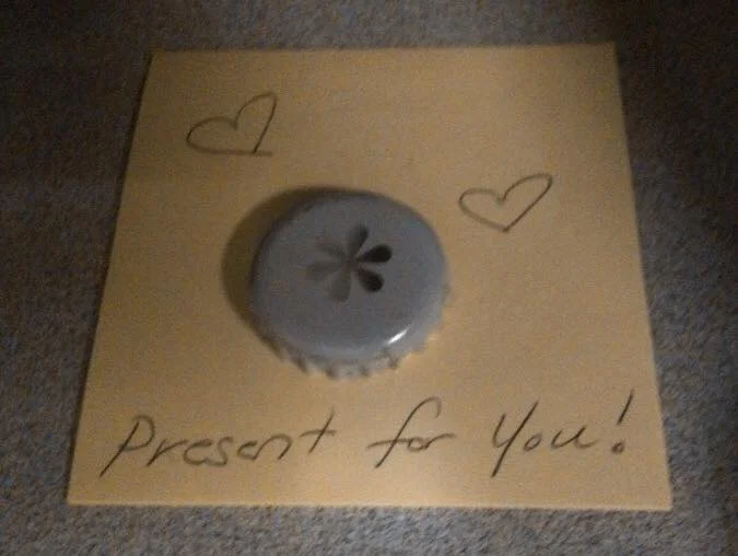 GREATER THAN OR EQUAL TO ONE BOTTLE CAP