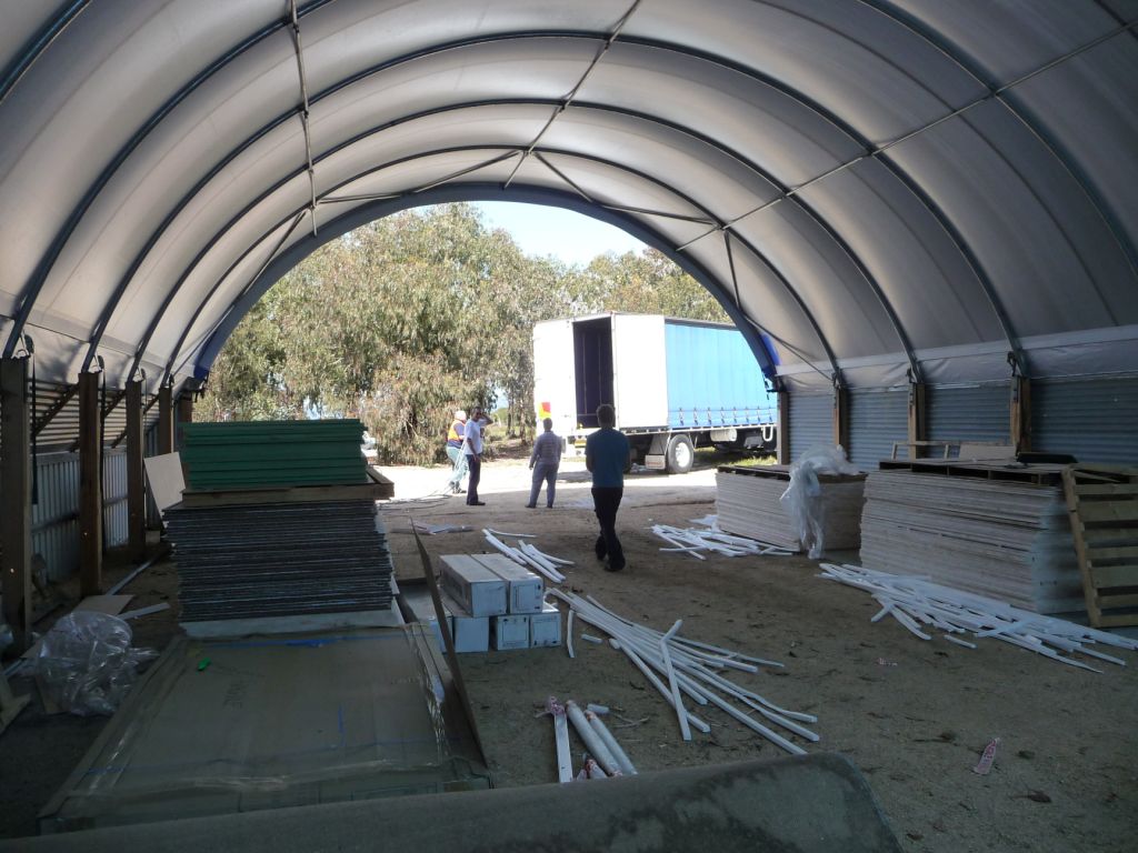 Stage 2 Kit arrives. Pictured is the flat composite panels from ATL Composites for the entire boat. DuFlex balsa E Glass panels for the structure, FeatherLight E Glass panels for the furniture and Airex foam for the cabin roof and appendages. October 2009.