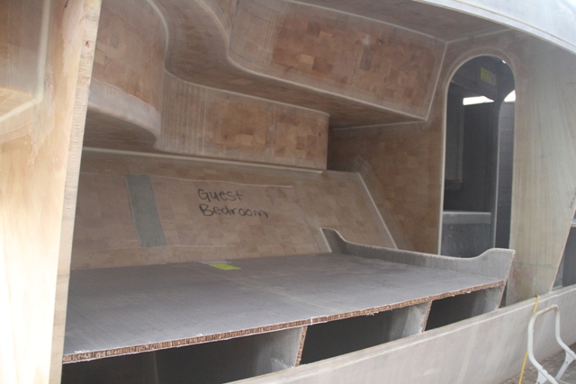 Furniture going in. This is the aft cabin looking from outside the boat before the hull sheer panel was installed. Interior spaces becoming defined allows for you to get a feel of the finished product. April 2011.