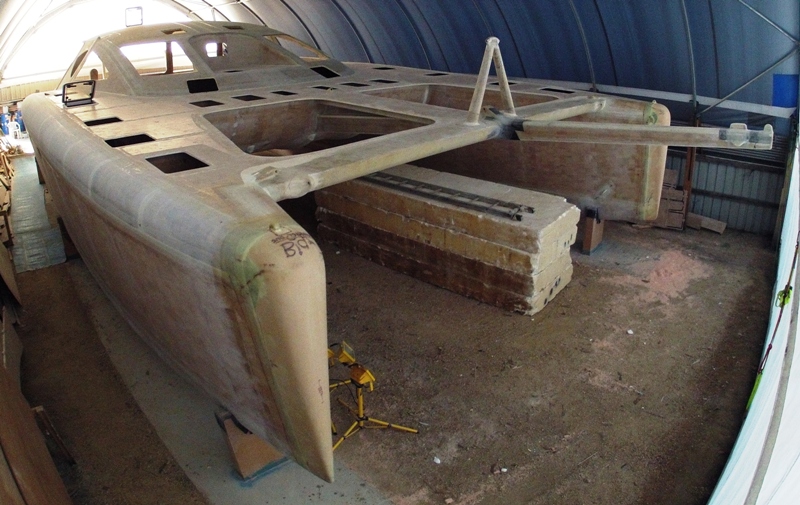 Cutting and fitting hatches and windows, bows formed and glassed. June 2012.