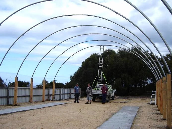 Building the shed. A temporary option was decided to be the best option for us. The lack of a full cement slab didn't cause too much of an issue but did make dust management more of a challenge during fairing and painting of the boat. December 2008.