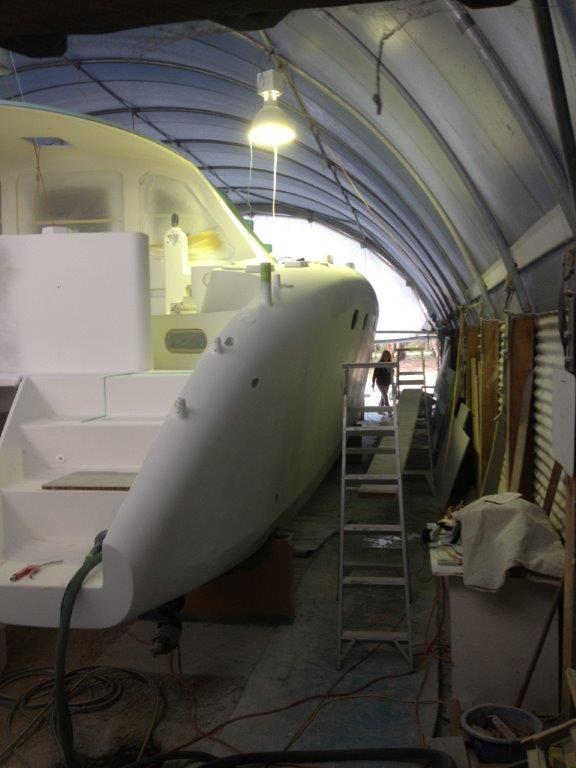 Working through the primer stages on the exterior. This slightly blurry photo helps to get a feel of the shed during this time. Dealing with dust a constant issue of the fairing process. September 2014.