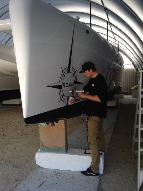 Decals installation. Will Bakker did an awesome job of producing and applying Michael's design to the boat. March 2015.