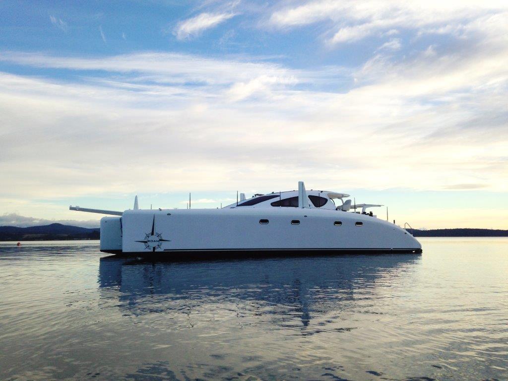 After the launch ROAM was secured to her mooring as darkness fell. This photo was taken as Andrew and Michael rowed away from the boat seeing her on the water for the first time. The photograph has been used by ATL Composites and Spirited Designs for advertising purposes. April 2015.