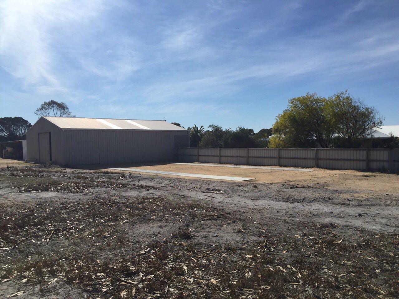 With ROAM gone the shed was removed in June 2015, after standing for 6 years and 7 months. The entrance between the build shed to John's workshop was closed and all that remains on site are the 2 concrete strips that the boat stood on. September 2015.
