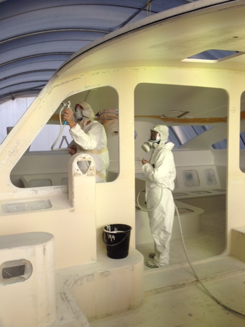 The Mirror Image crew spraying High Build Primer in the saloon of ROAM. March 2014.