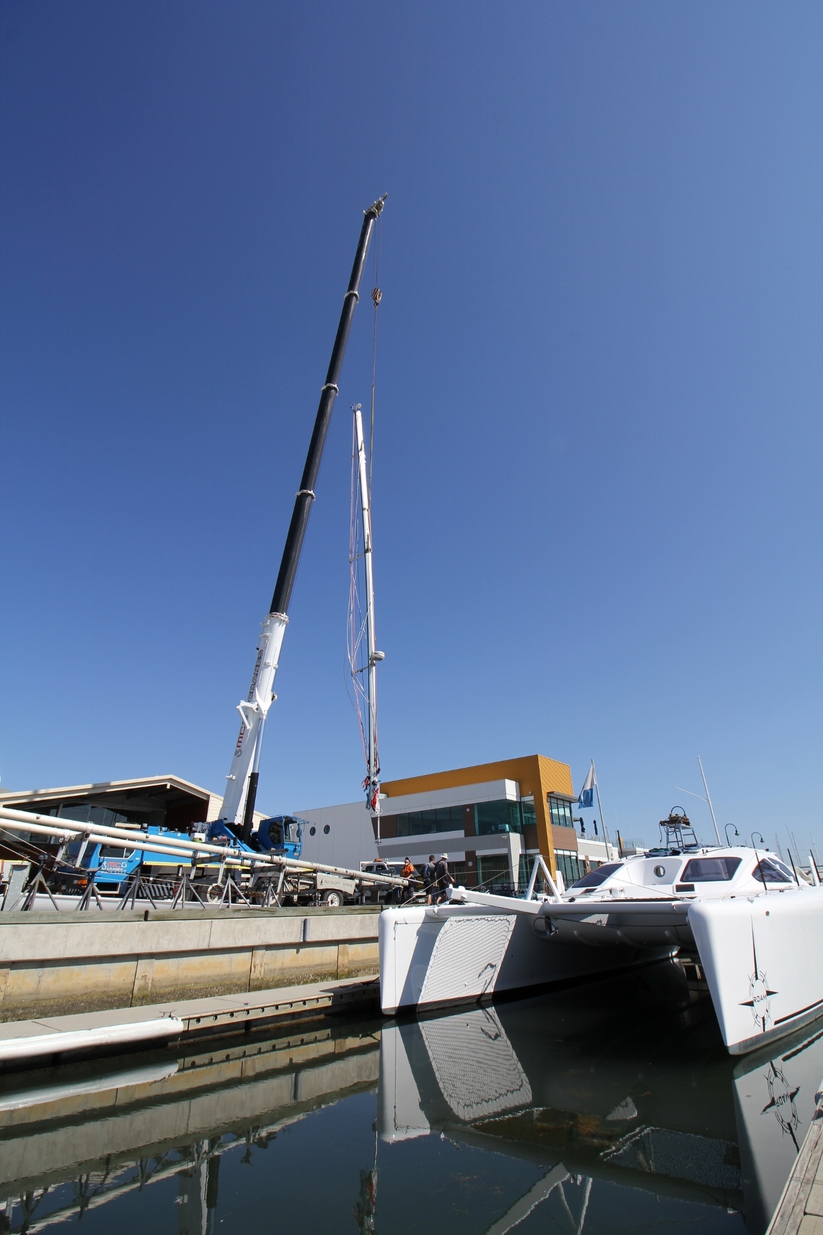 The mast upended from AYS's trailer and lifted directly to ROAM. Having a crane with plenty of hook height and radius made for an easy lift.