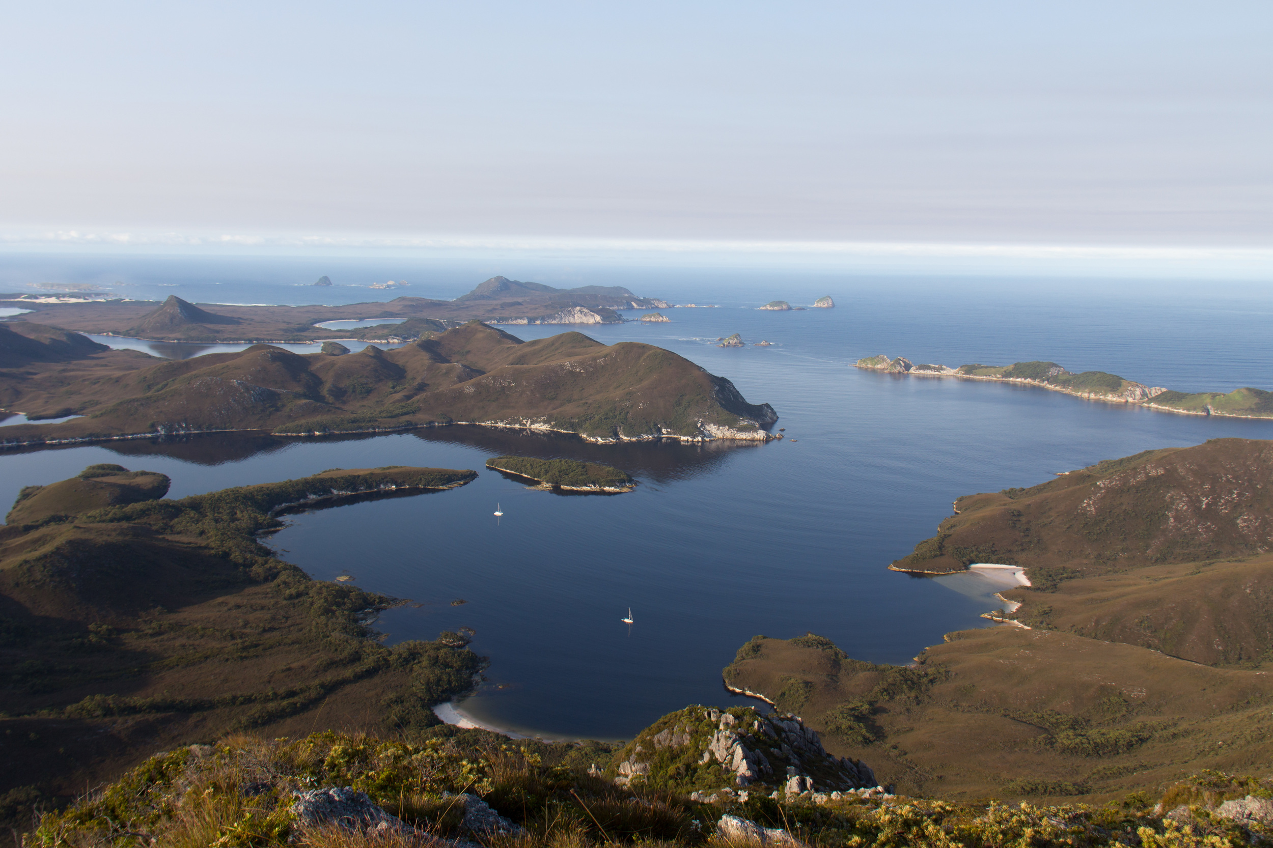 Mount Misery summit looking South West with ROAM anchored just inside Sarah Island.
