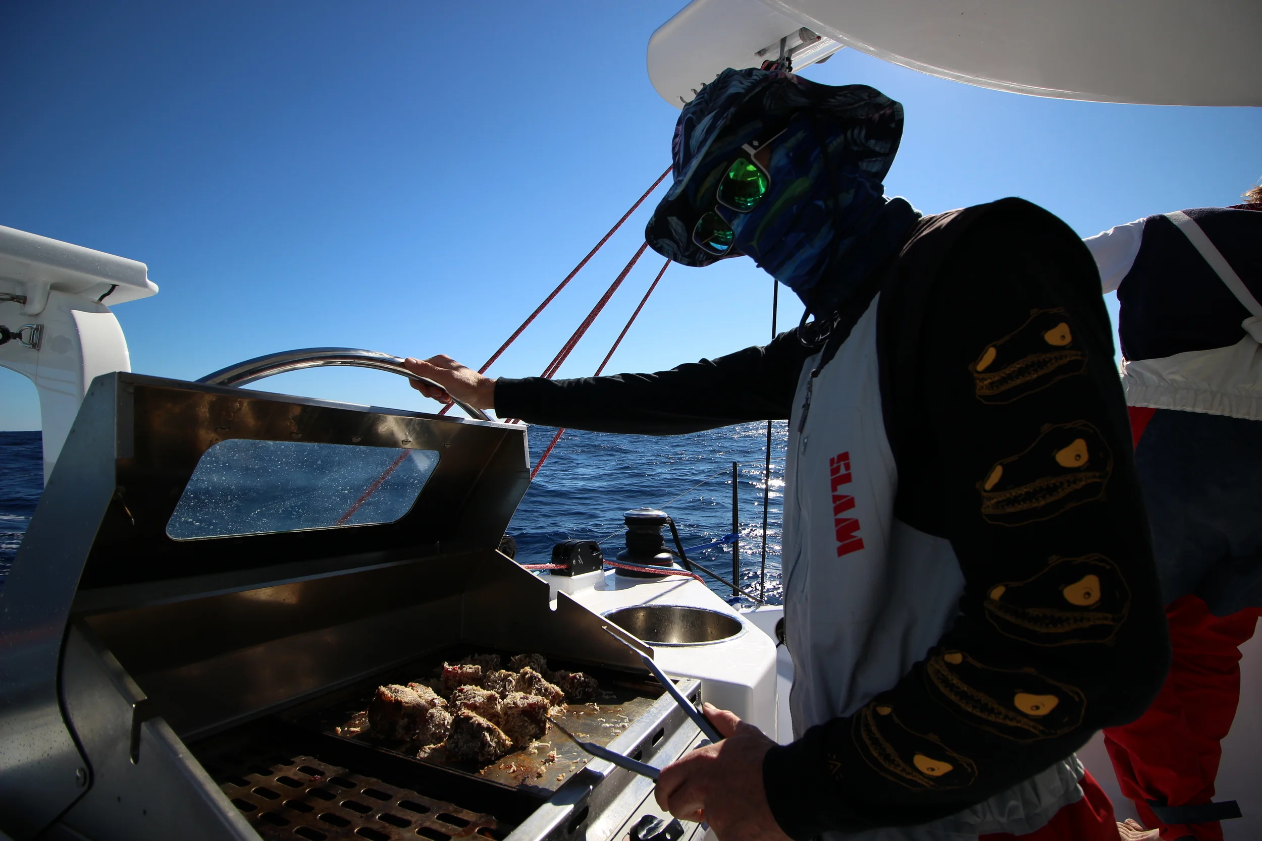 Captain Mick cooking up the Tuna we caught on the way on the BBQ. Sporting his full sun protection. You need it living on a boat exposed to the sun majority of the day.