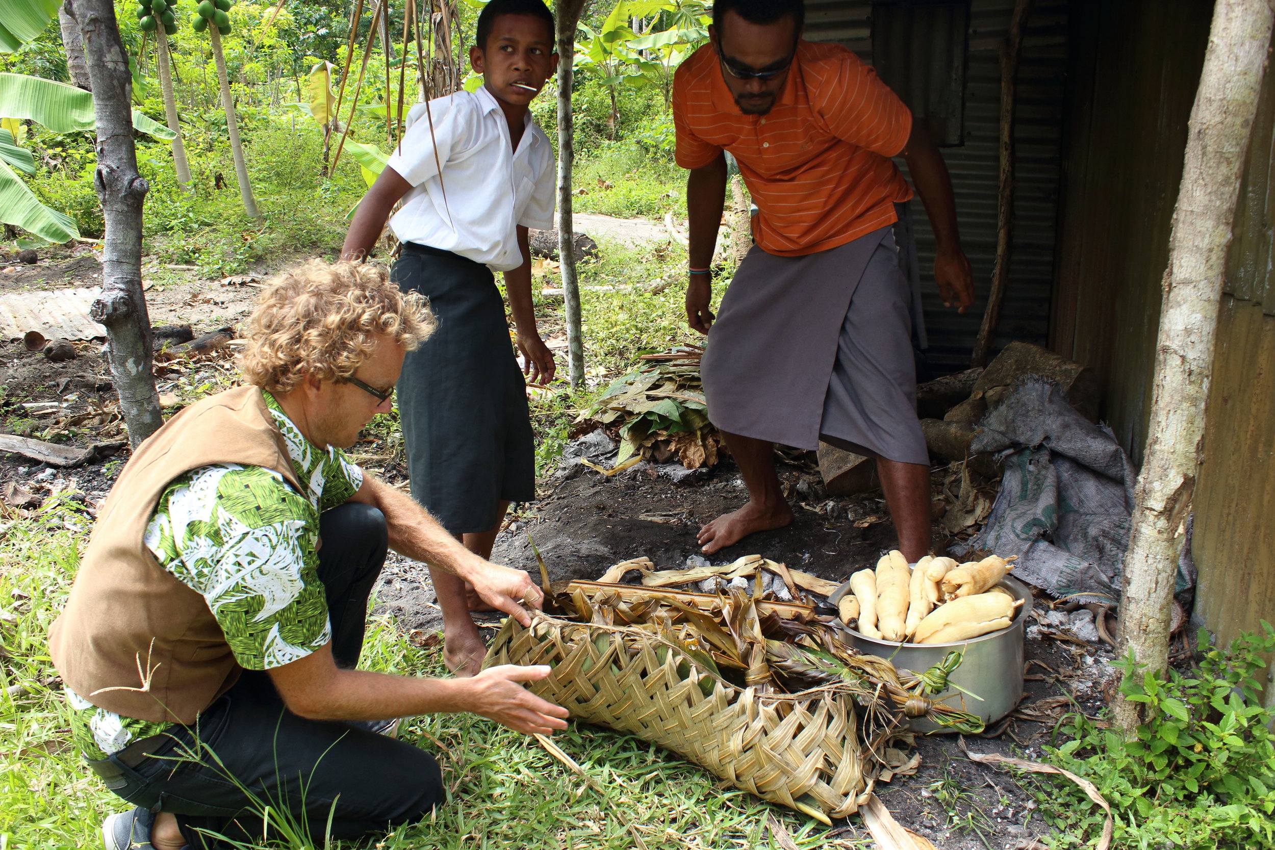 Removing the food from the Lovo ready for Sunday lunch 