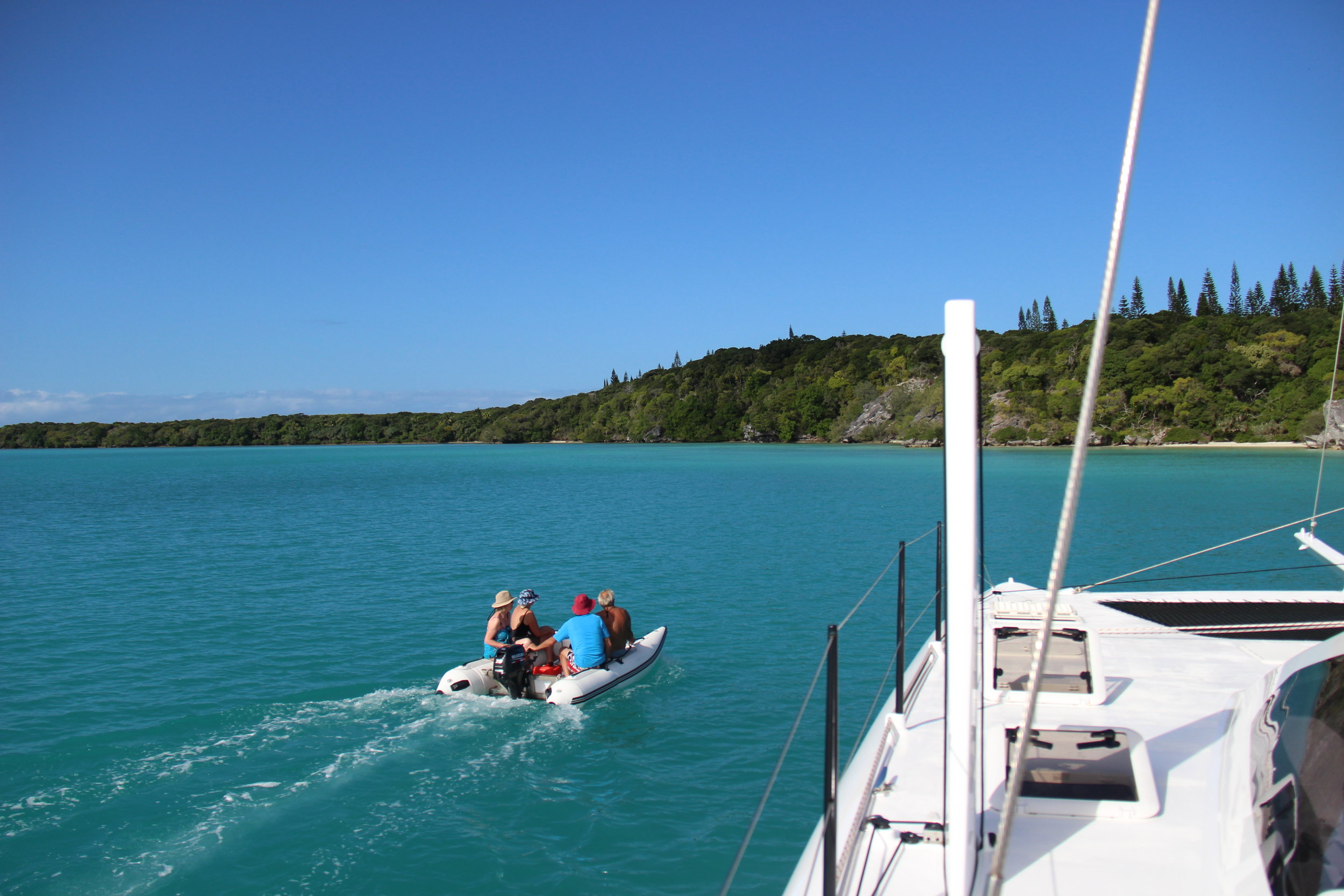 The Parents zipping off in the Dingy to explore 