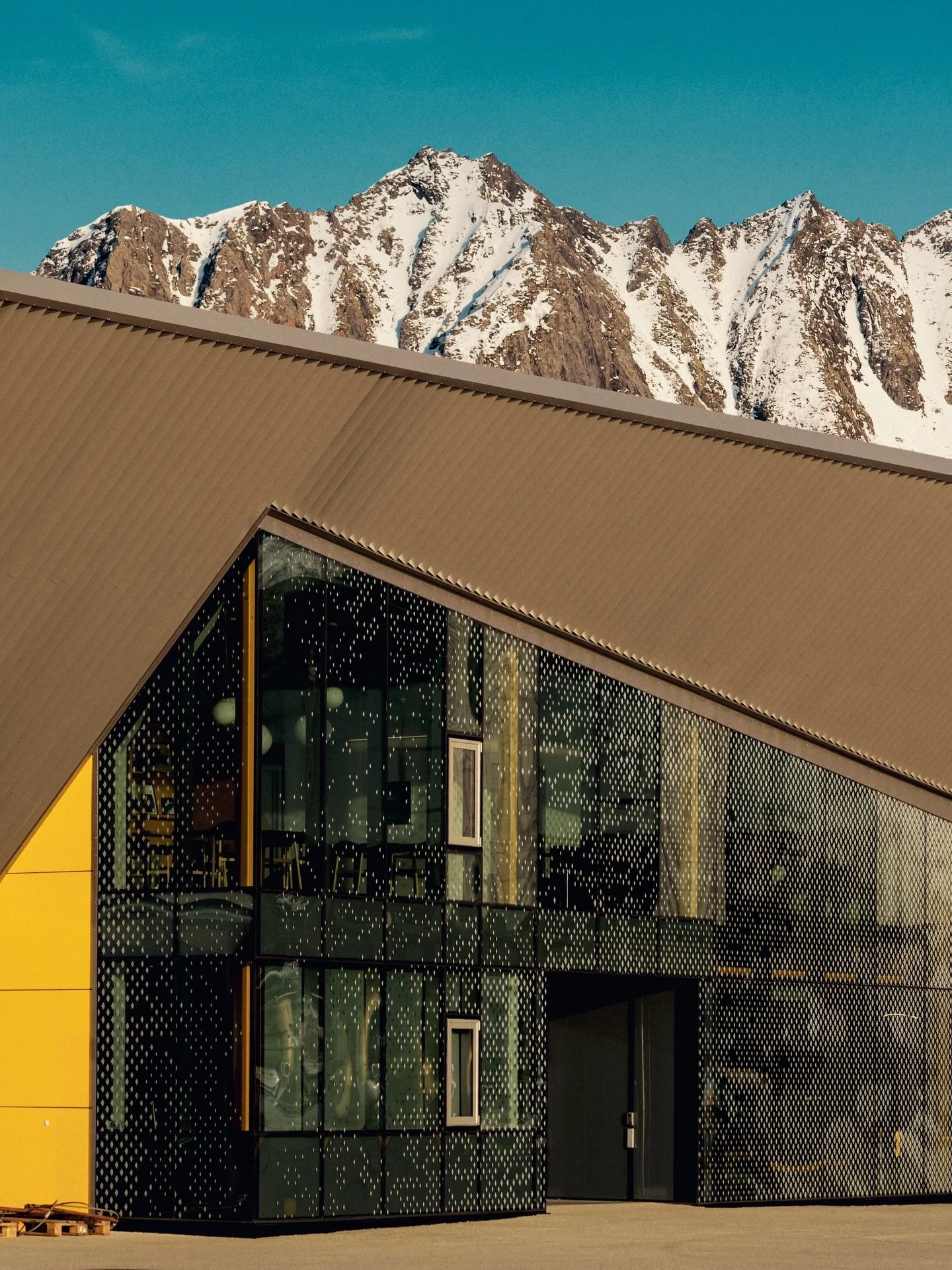 A day with no wind is a rare occasion in Arctic Norway, but when I visited @holmoy.maritime for @snohetta a month ago, I got to enjoy every second outside..taking in the shapes and colors of these industrial buildings, set in what must be one of Nord