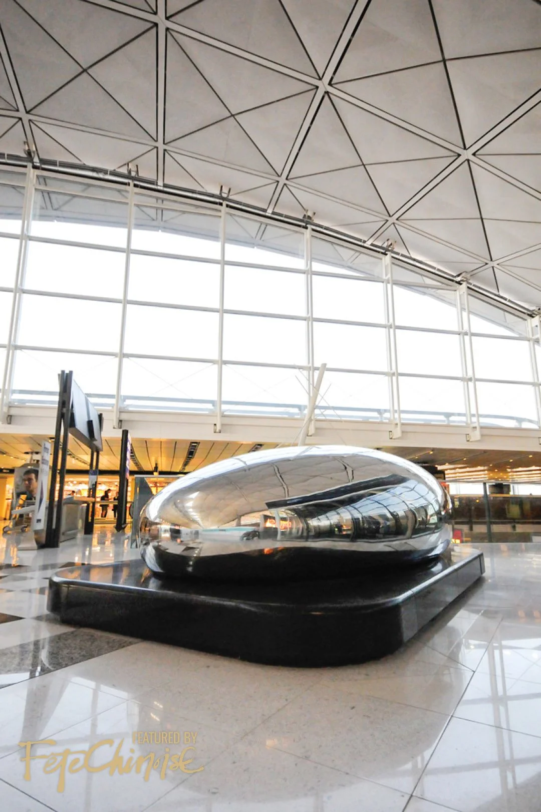 a dewdrop 一棵露珠.400 x 260 x 130 cm H. Stainless steel , black stone 不鏽鋼 , 黑石. 香港國際機場 Hong Kong international airport. 2005.