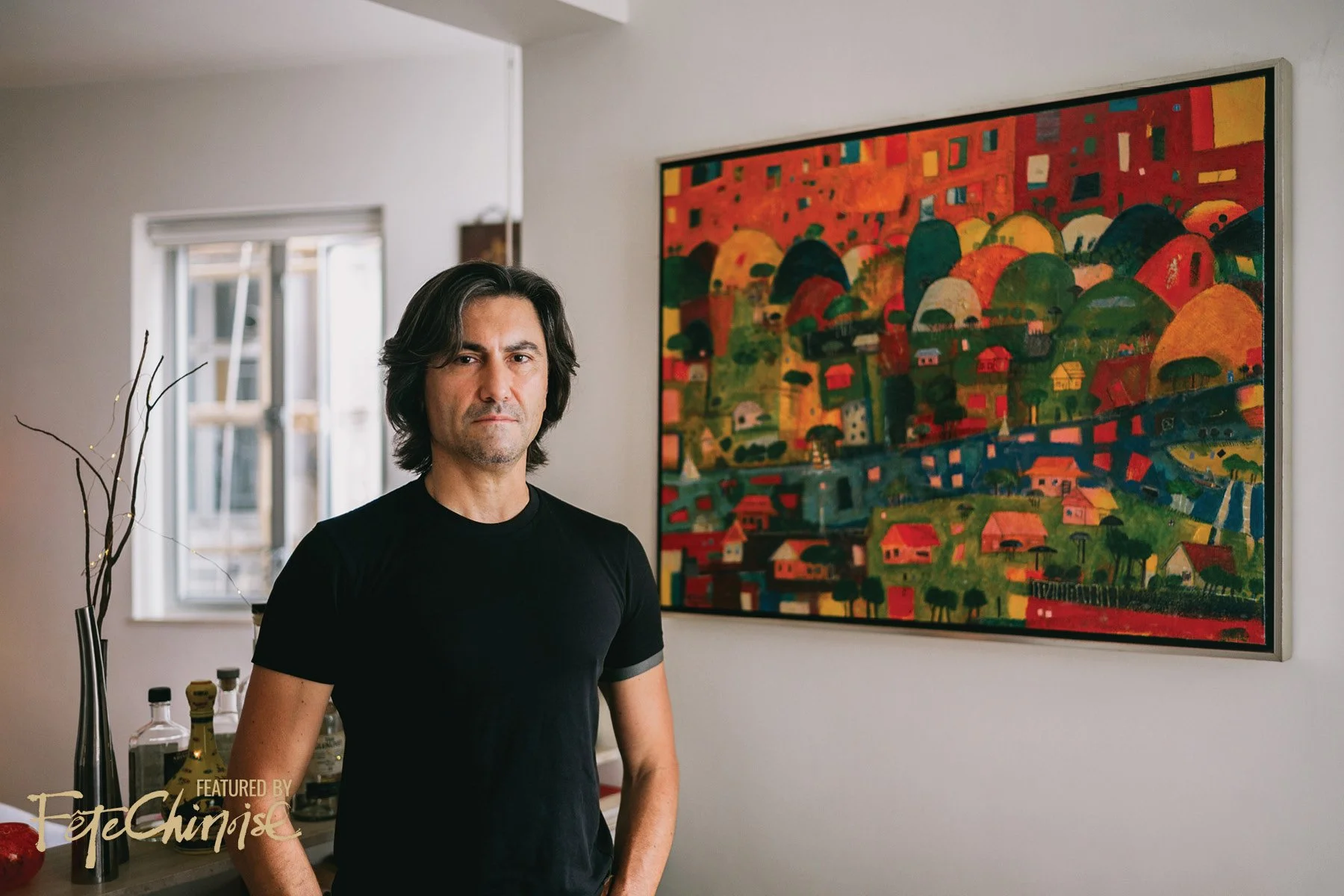 Francesco standing next to his painting in his studio. PHOTOGRAPHY: Thien-Ty LY